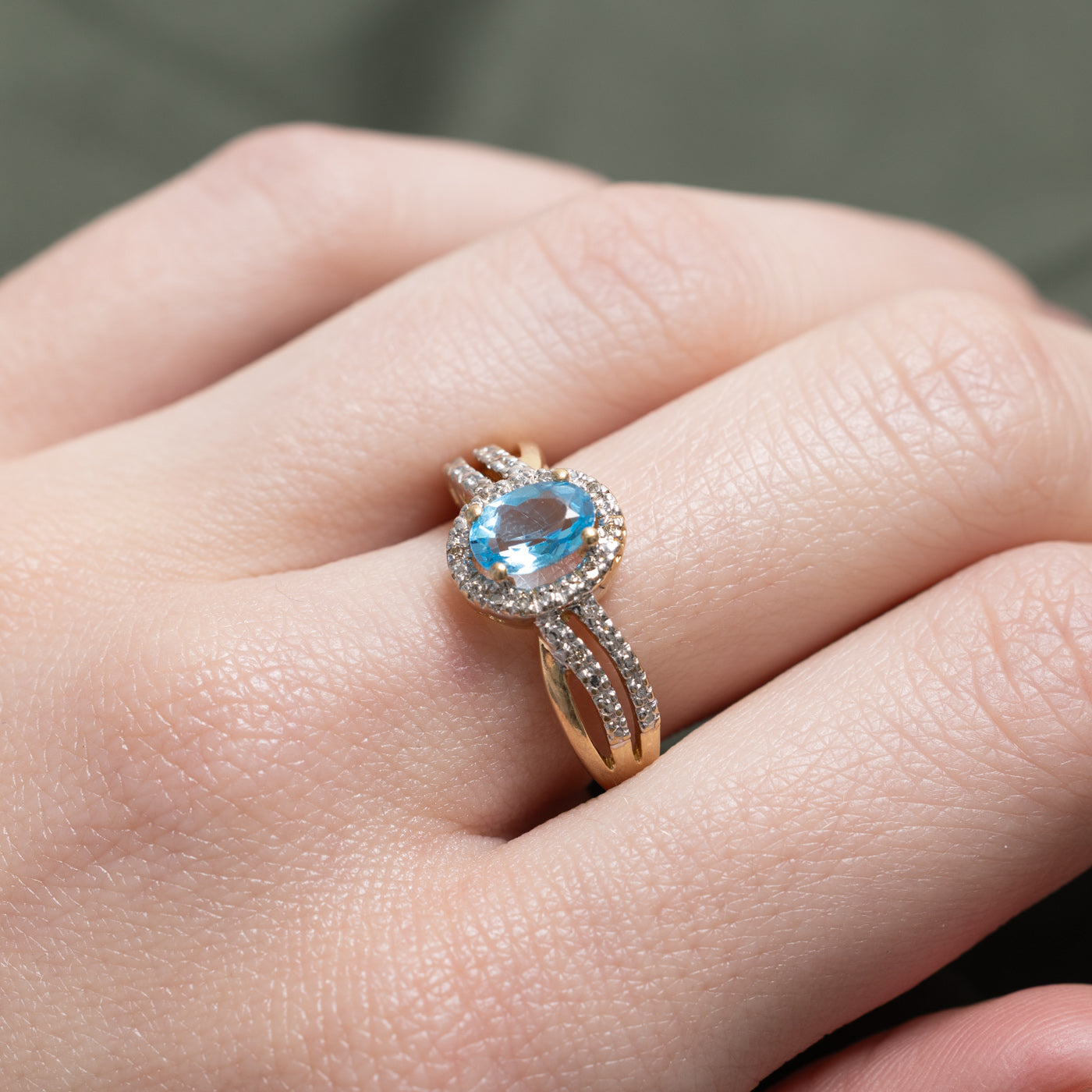 Oval Cut Blue Topaz & Diamond Halo Crossover Ring | 0.73ct, 0.06ctw | SZ 7.25 |