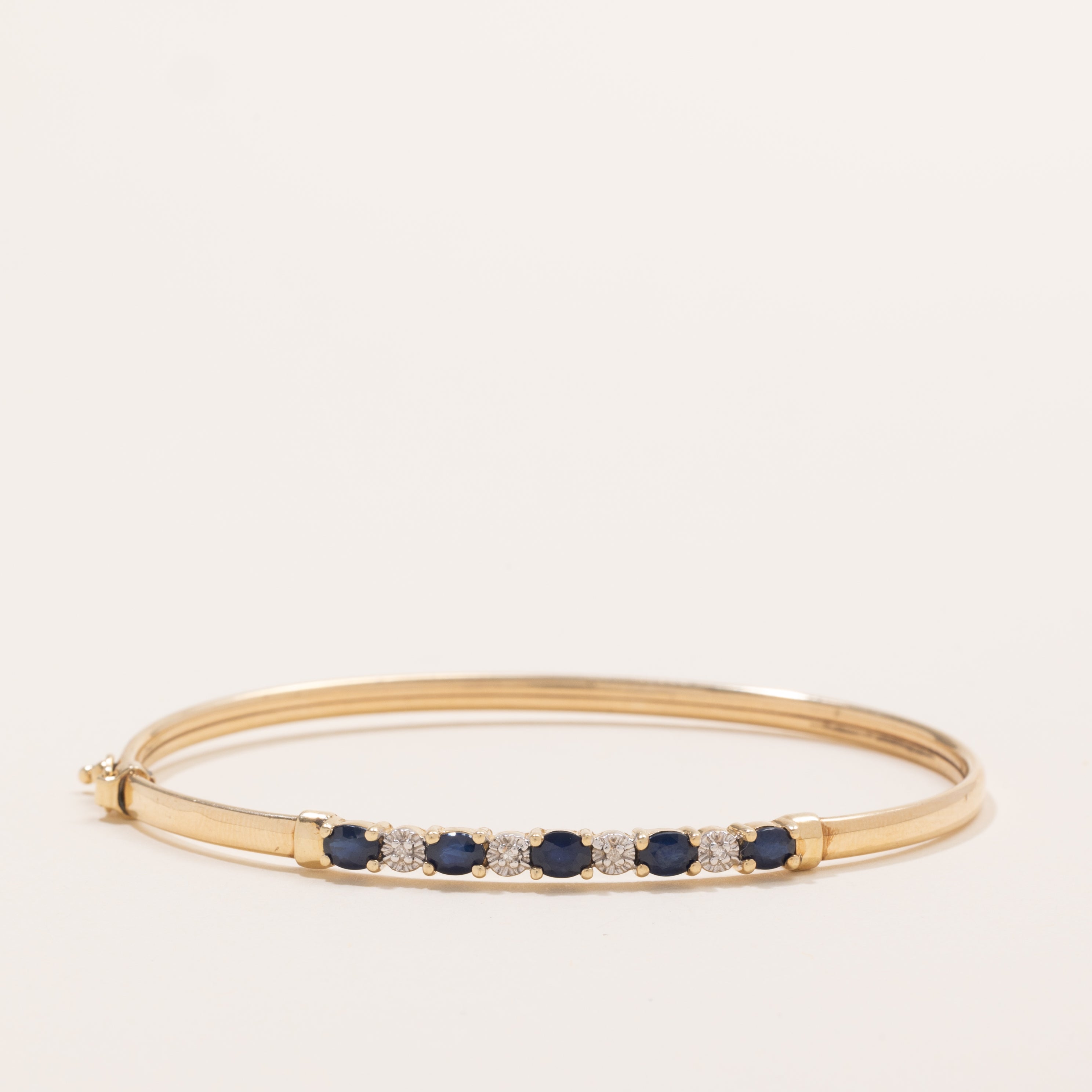 Oval Cut Sapphire & Diamond Cuff Bracelet | 1.25ctw, 0.02ctw | 7" |