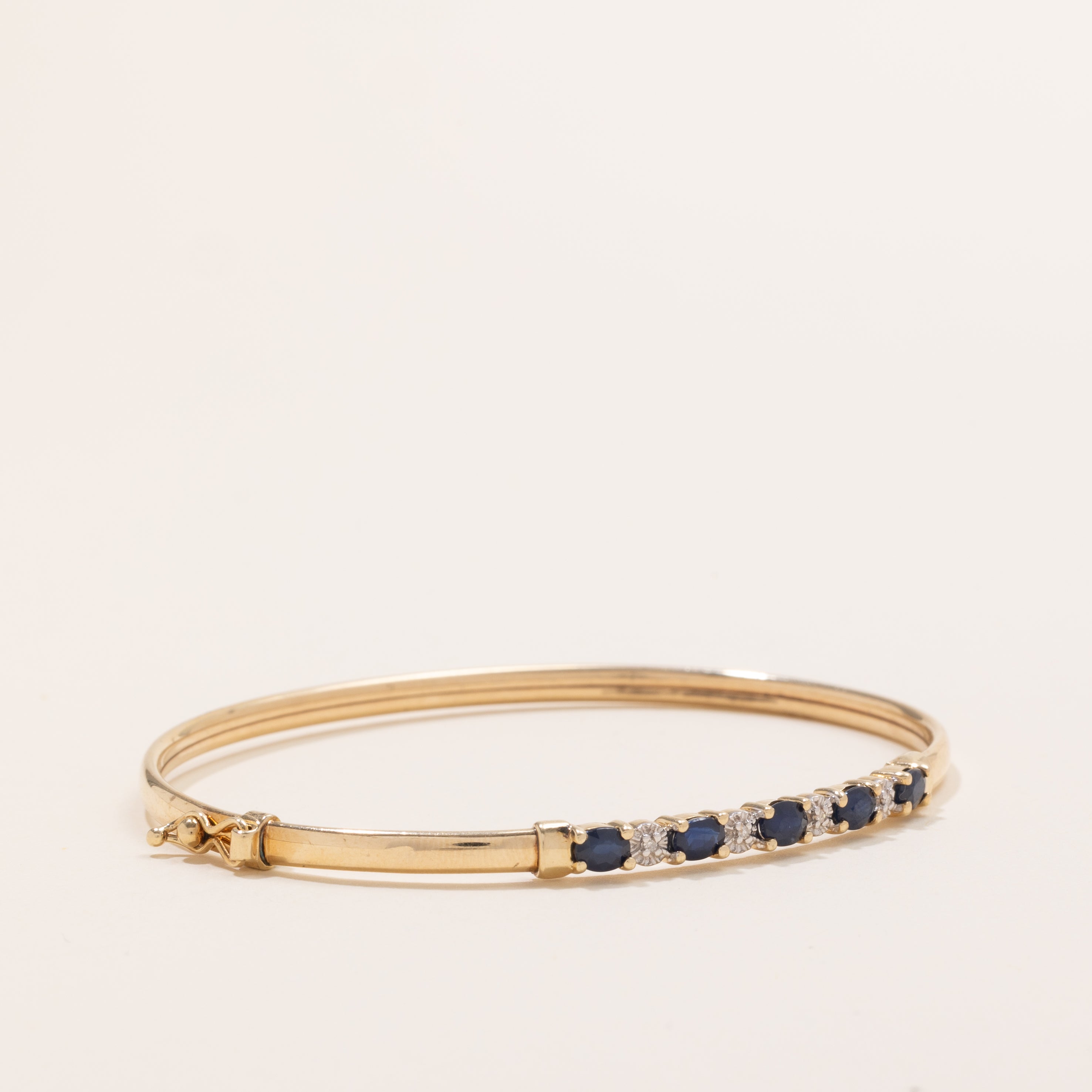 Oval Cut Sapphire & Diamond Cuff Bracelet | 1.25ctw, 0.02ctw | 7" |
