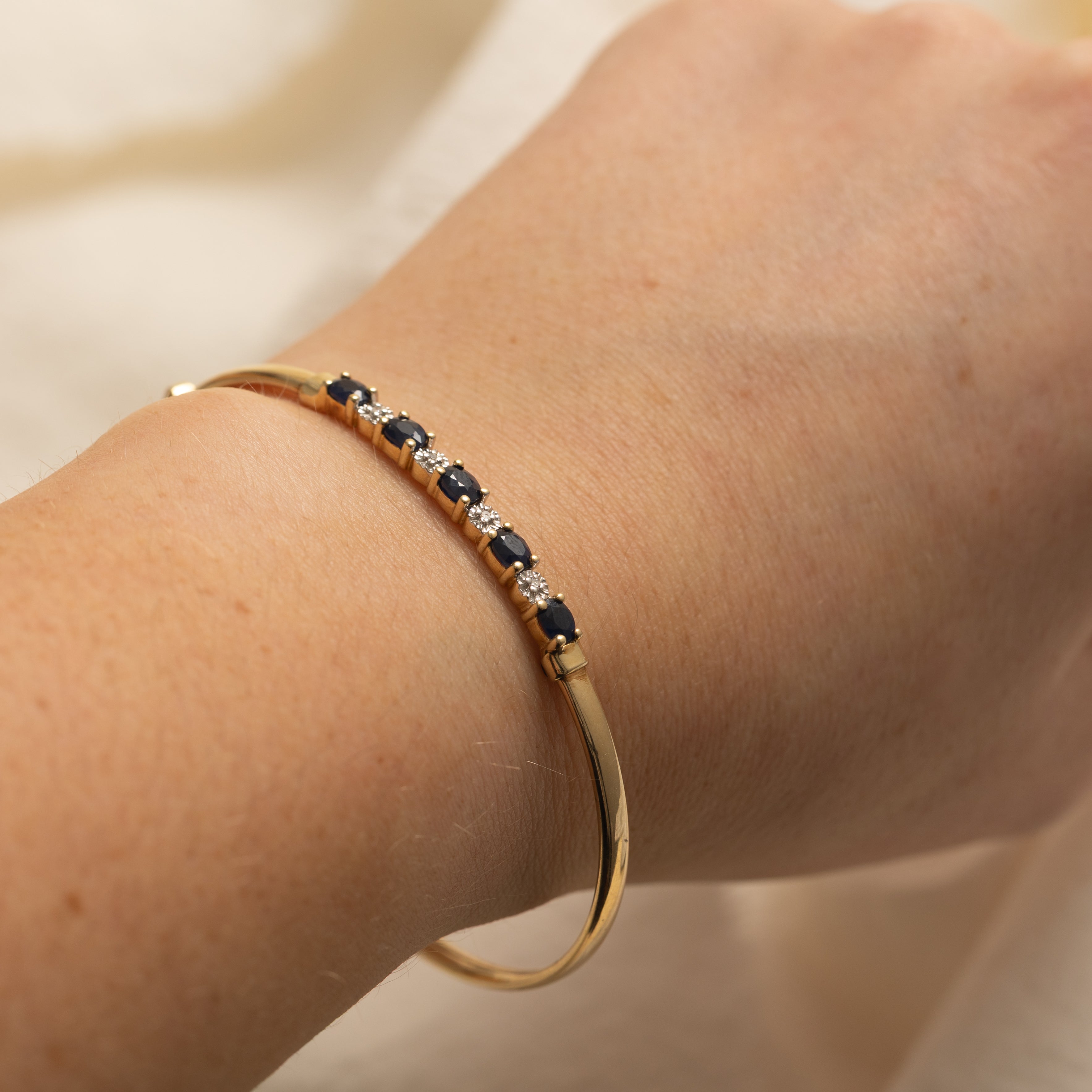 Oval Cut Sapphire & Diamond Cuff Bracelet | 1.25ctw, 0.02ctw | 7" |