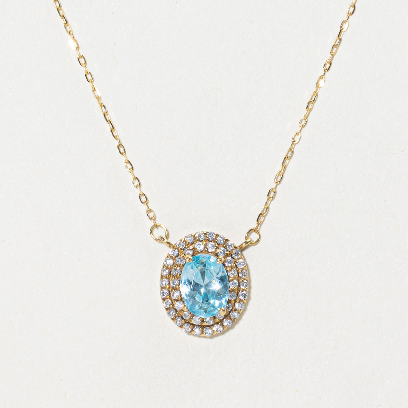18k Oval Cut Blue Topaz & Diamond Halo Pendant Necklace | 1.12ct, 0.22ctw | 16"