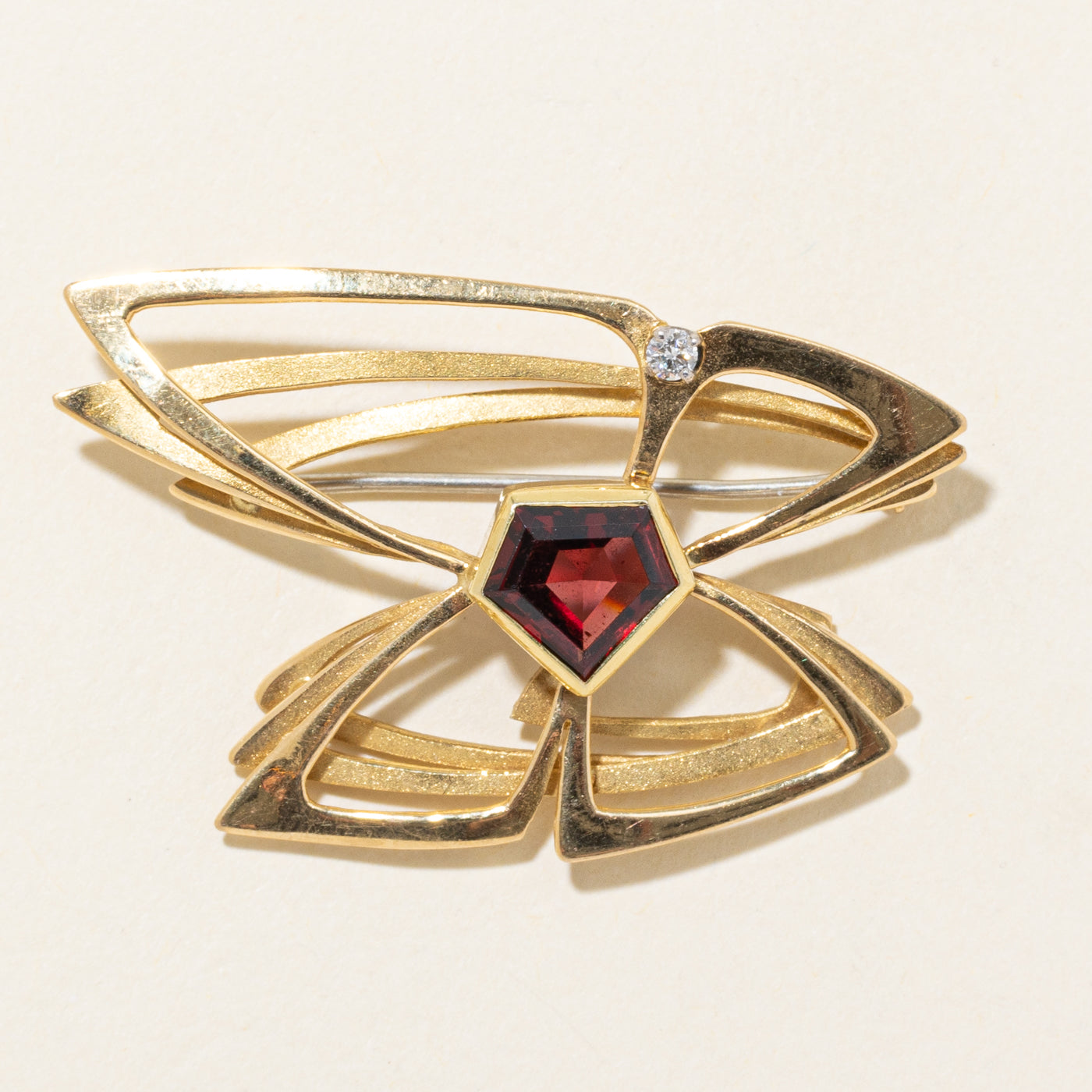 'Neil Carrick Aird' 1988 Garnet & Diamond Papillion Brooch | 2.75ct, 0.06ct