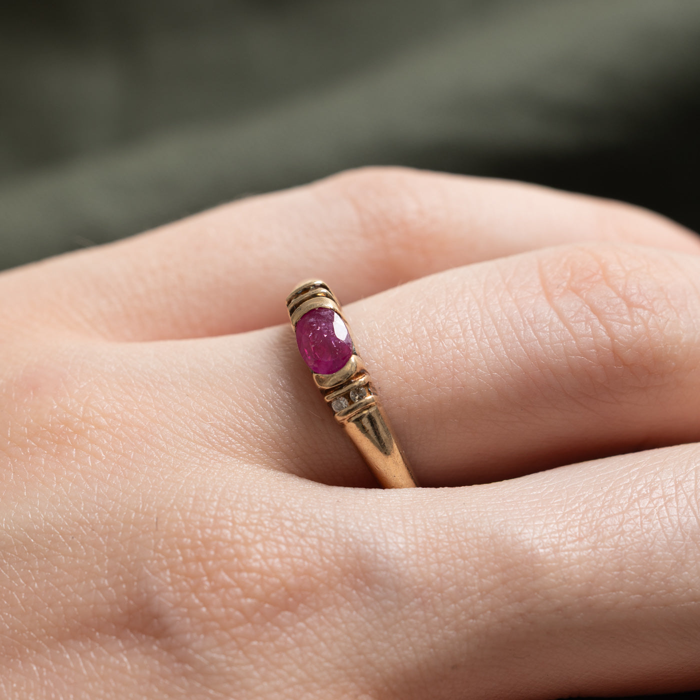 10k East West Oval Cut Ruby & Diamond Accented Ring | 0.50ct, 0.02ctw | SZ 6.75
