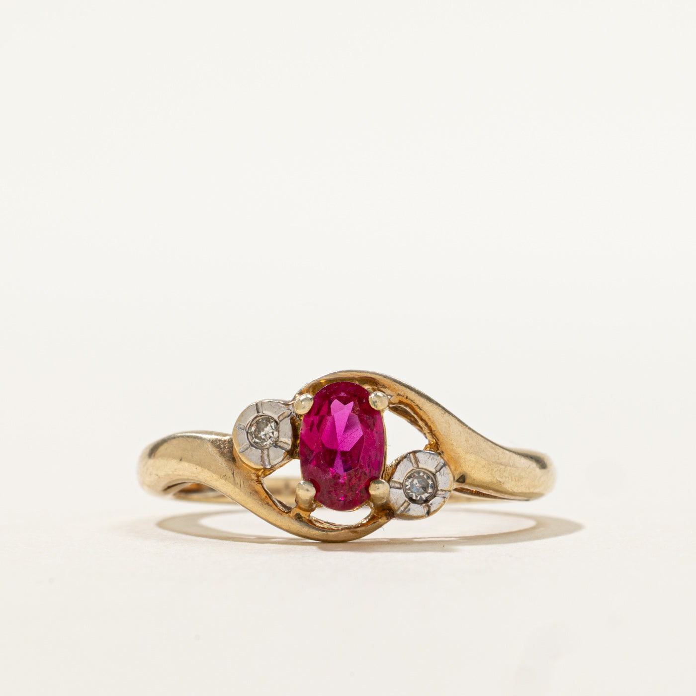 9k Oval Cut Synthetic Ruby & Diamond Bypass Ring | 0.50ct, 0.02ctw | SZ 6.5