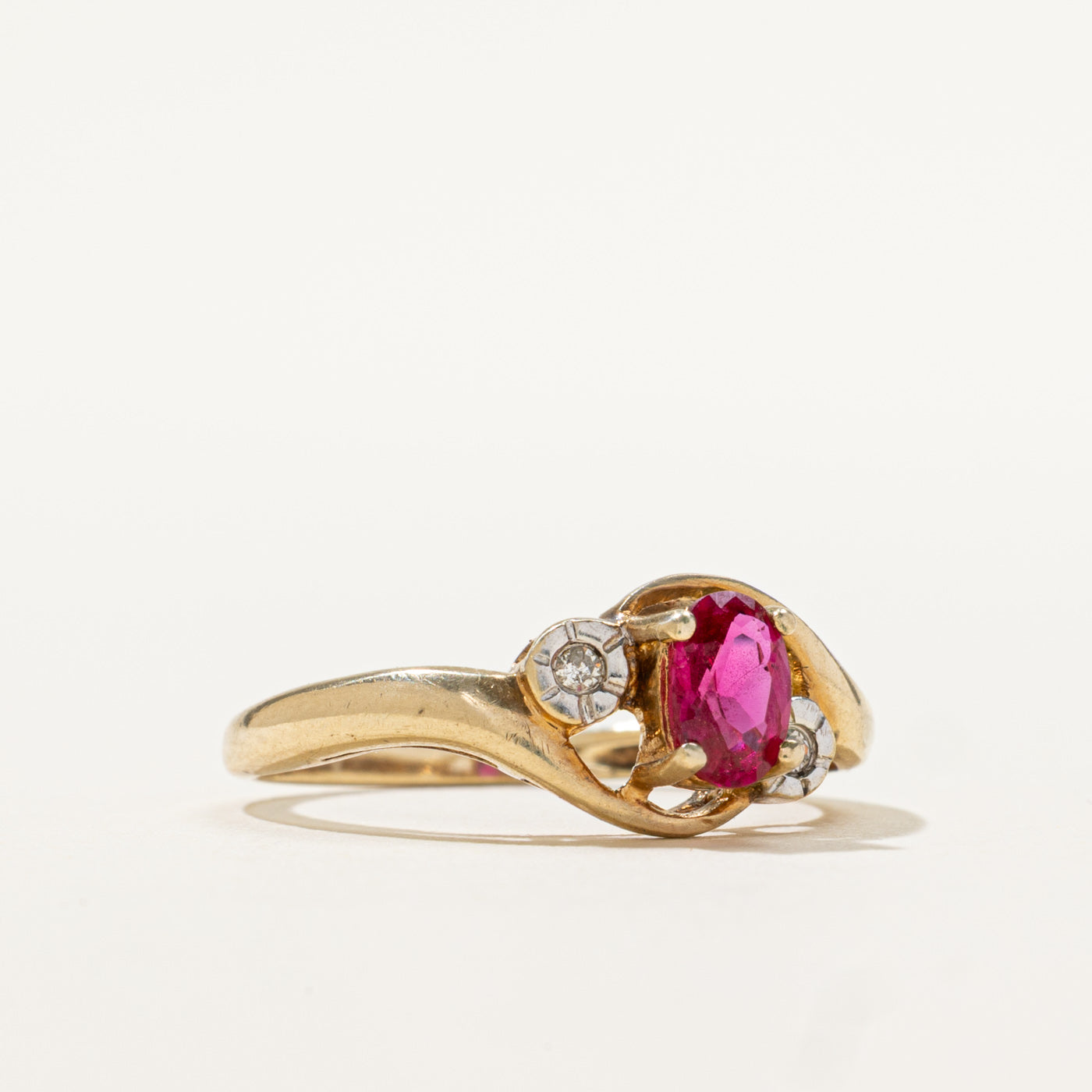 9k Oval Cut Synthetic Ruby & Diamond Bypass Ring | 0.50ct, 0.02ctw | SZ 6.5