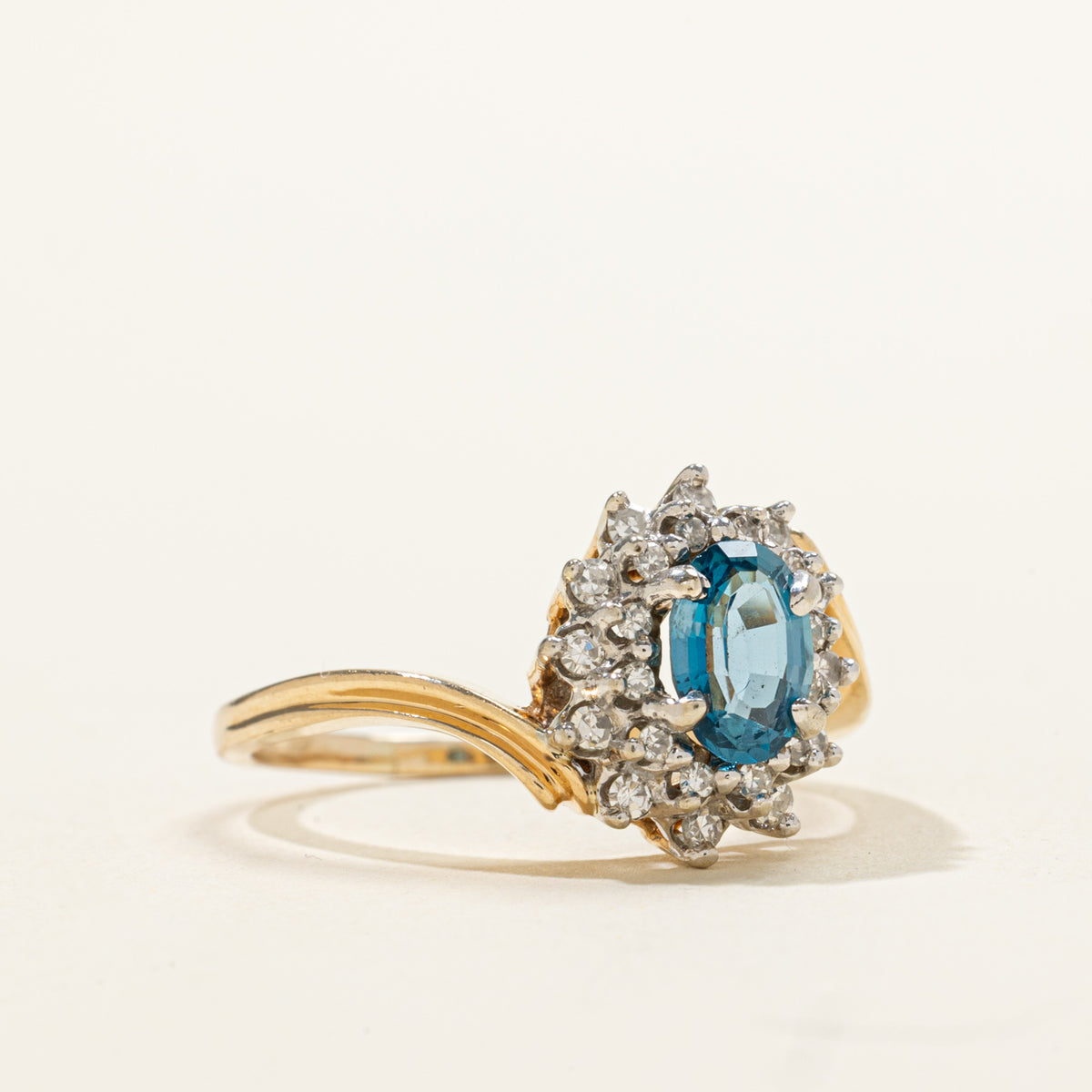 14k Oval Cut Blue Topaz & Diamond Petal Halo Bypass Ring | 0.95ct, 0.18ctw | SZ 8.25