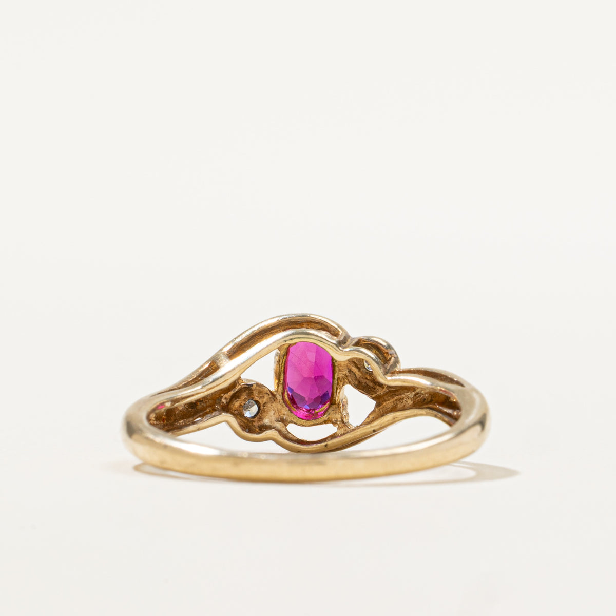 9k Oval Cut Synthetic Ruby & Diamond Bypass Ring | 0.50ct, 0.02ctw | SZ 6.5