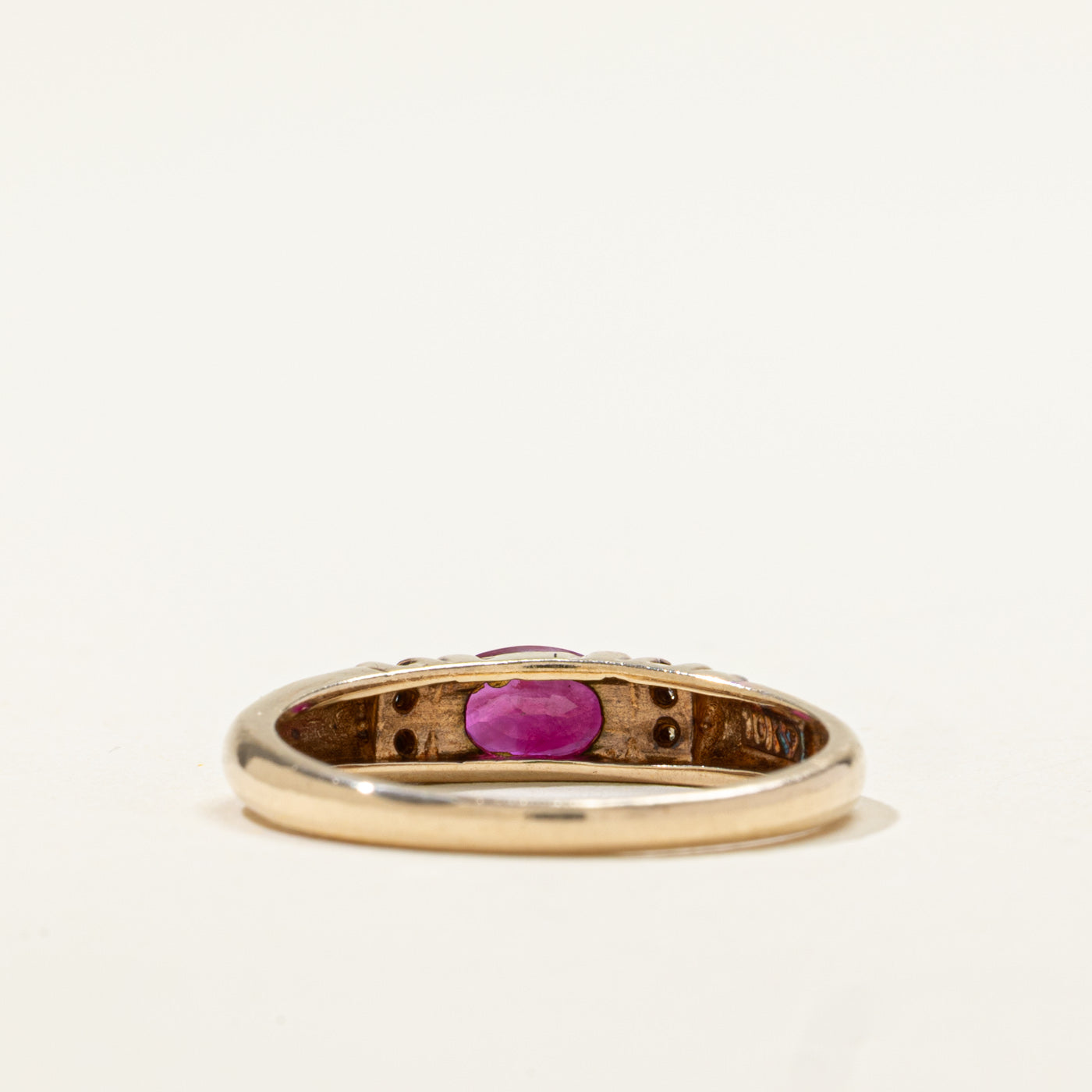 10k East West Oval Cut Ruby & Diamond Accented Ring | 0.50ct, 0.02ctw | SZ 6.75