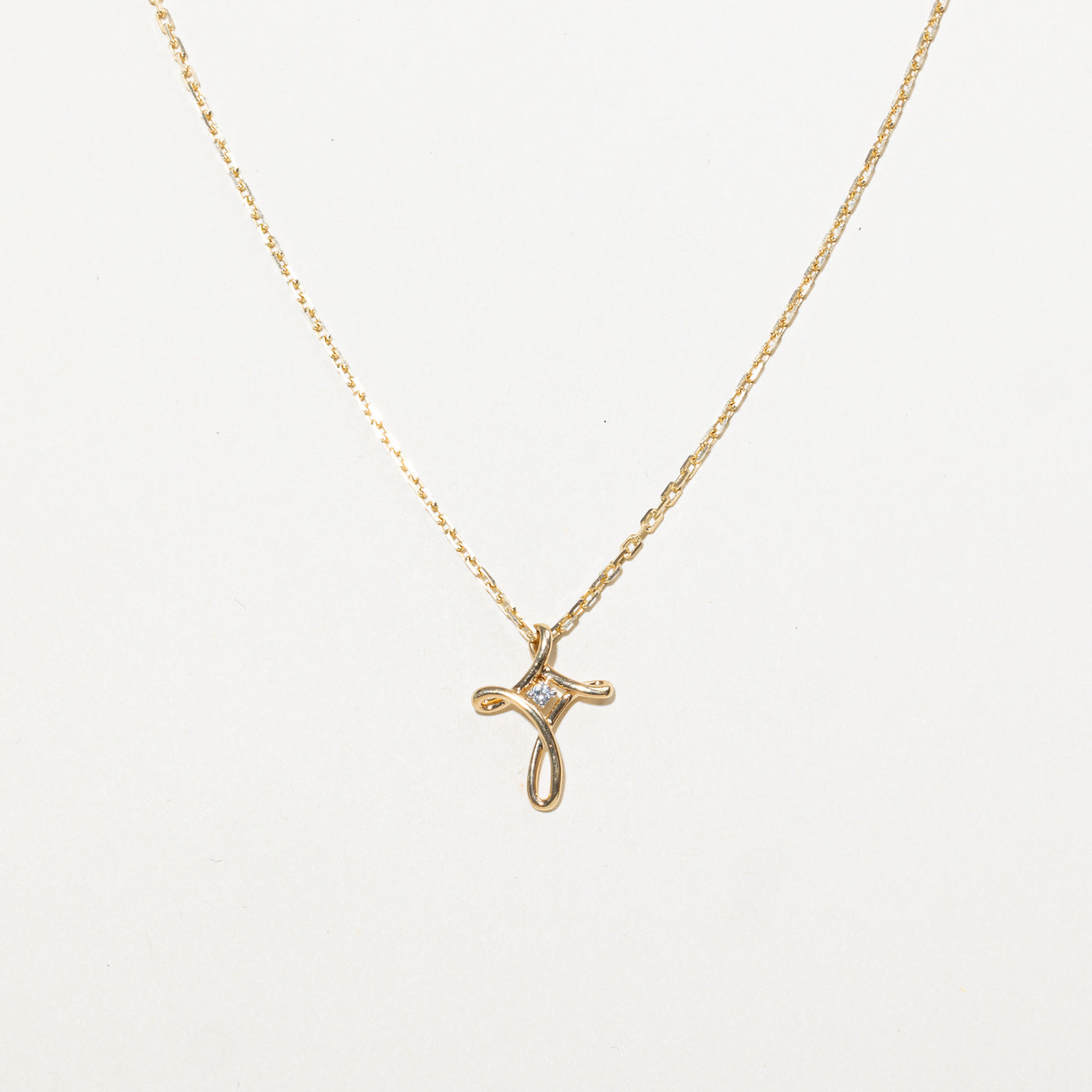10K Diamond Twist Cross Pendant Necklace | 16"