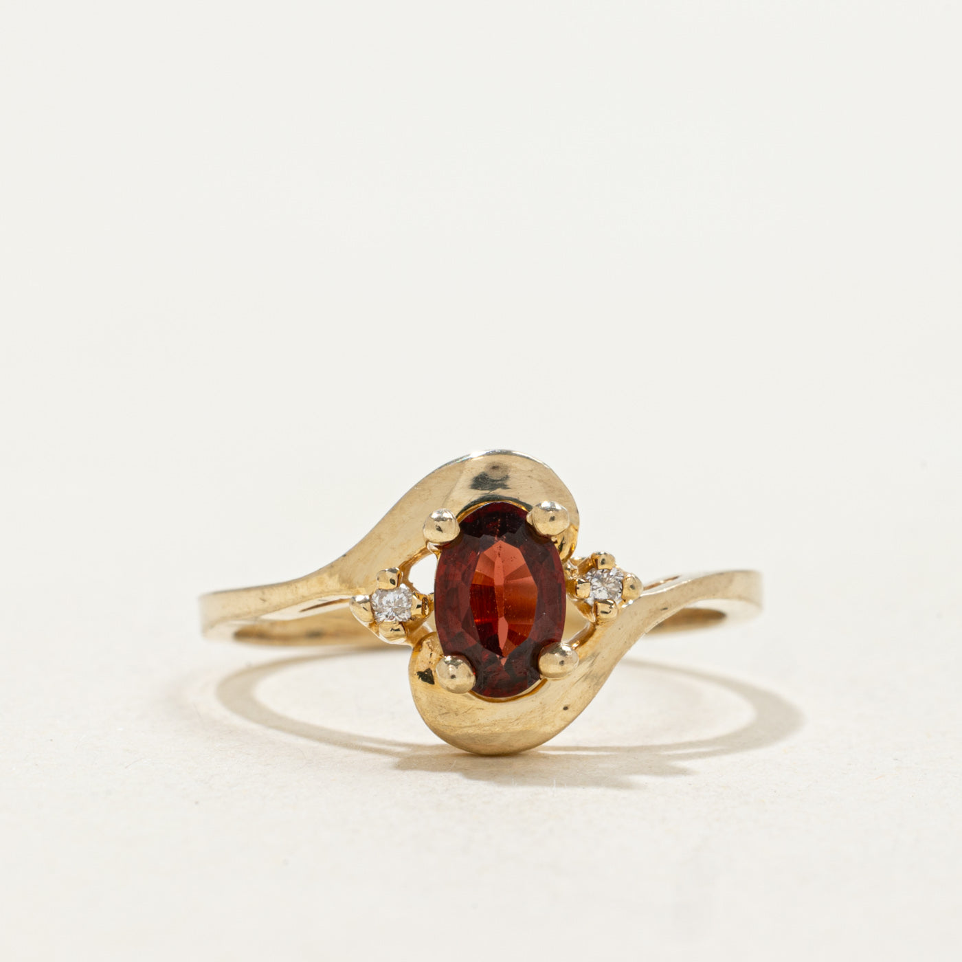 10k Oval Cut Garnet & Diamond Accented Bypass Ring | SZ 5.25