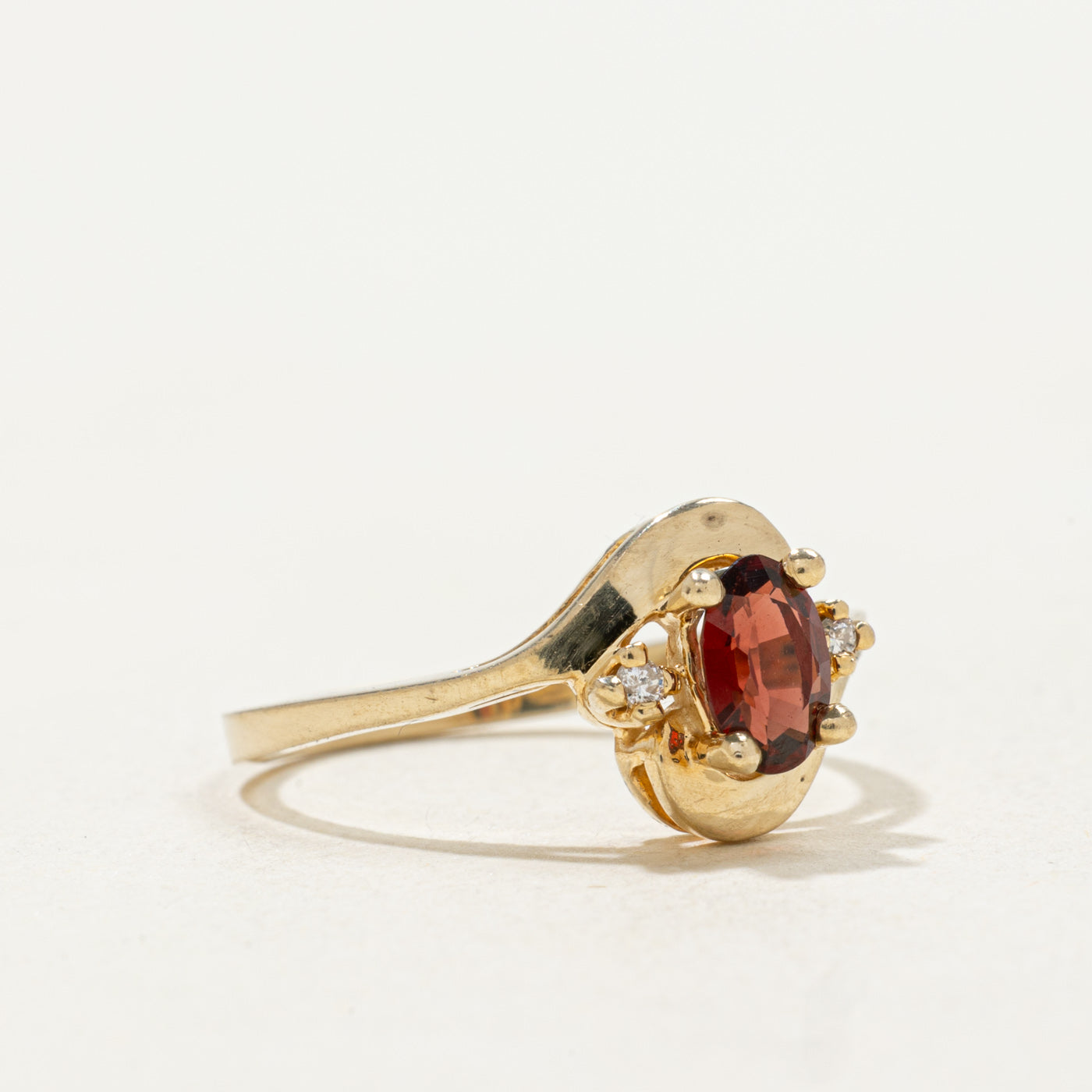 10k Oval Cut Garnet & Diamond Accented Bypass Ring | SZ 5.25