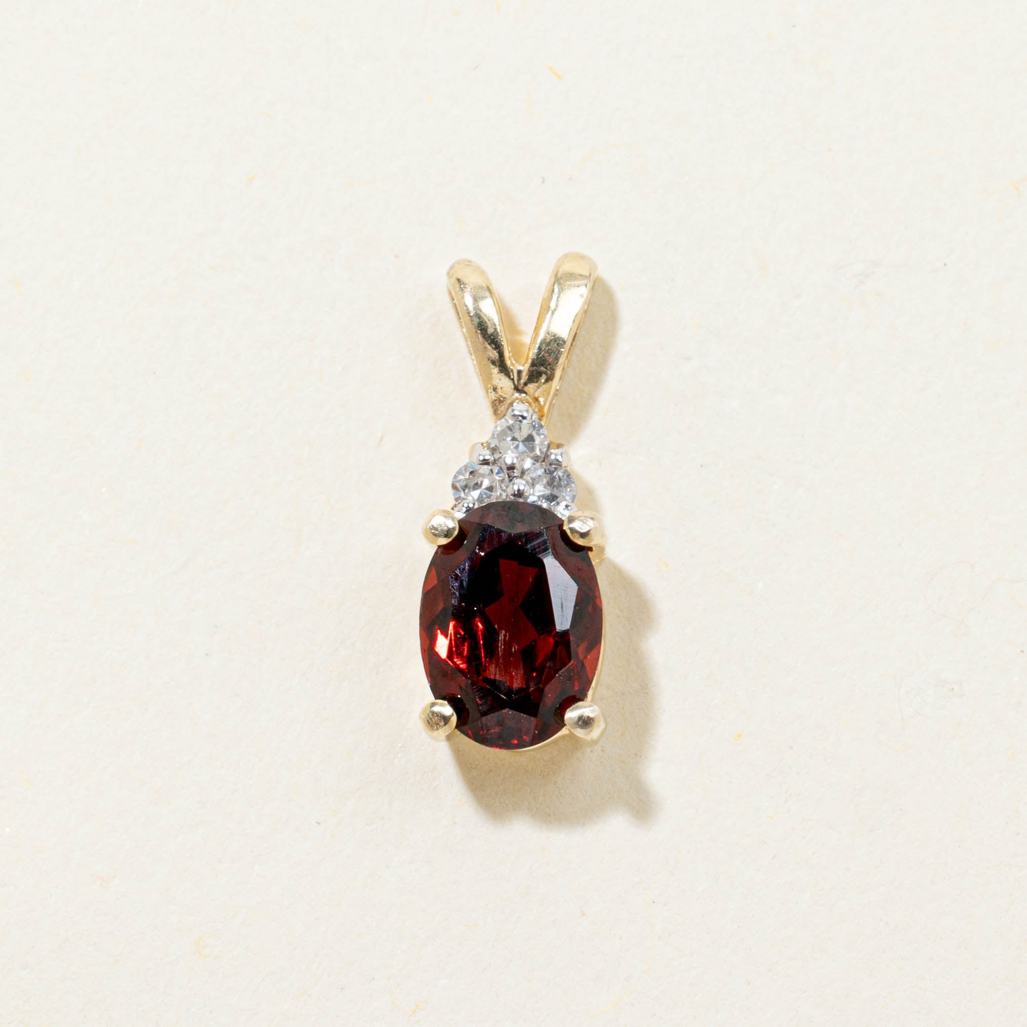 14k Oval Cut Garnet & Diamond Accented Pendant | 0.80ct, 0.02ctw