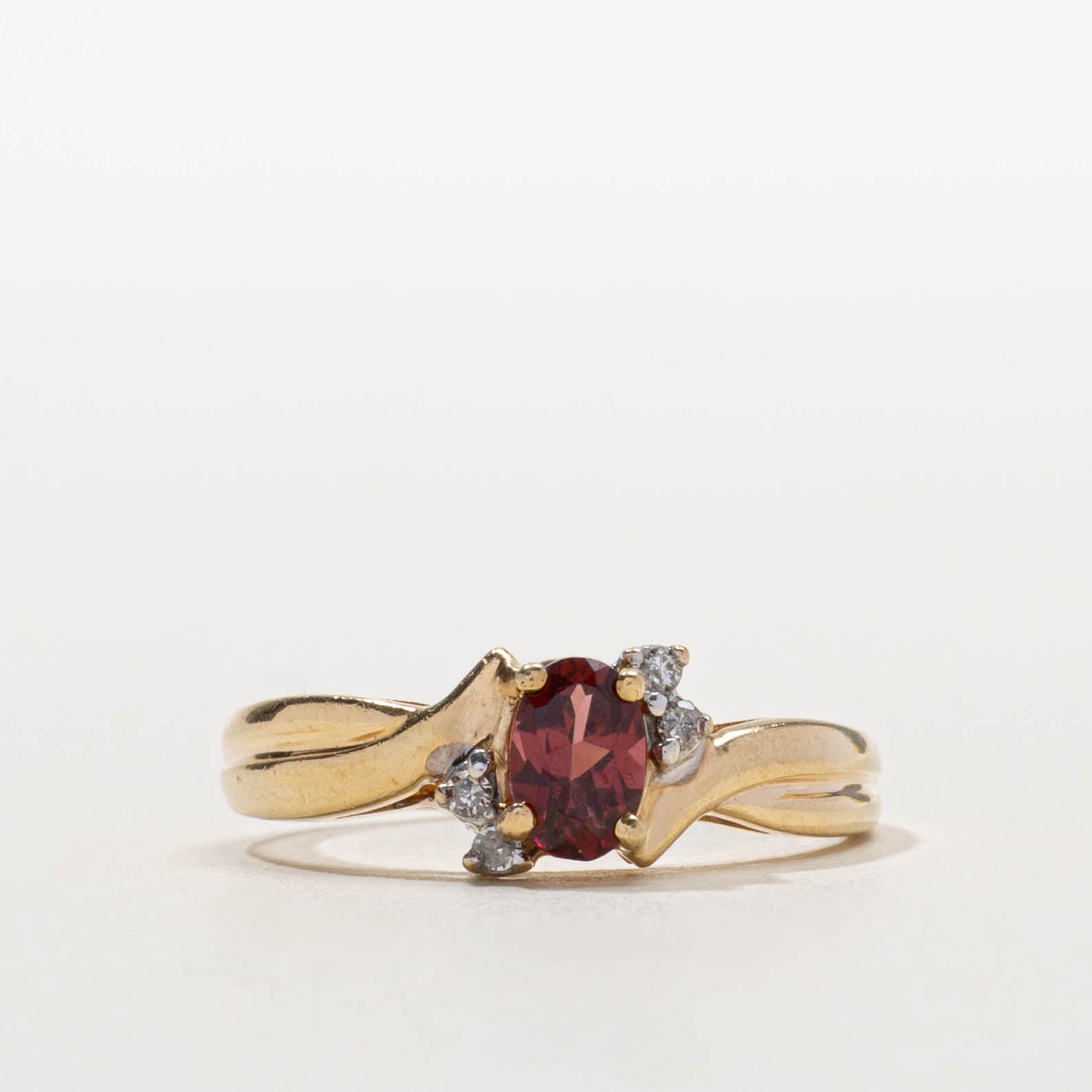 10k Garnet & Diamond Accented Crossover Ring | 0.50ct, 0.04ctw | SZ 7.75