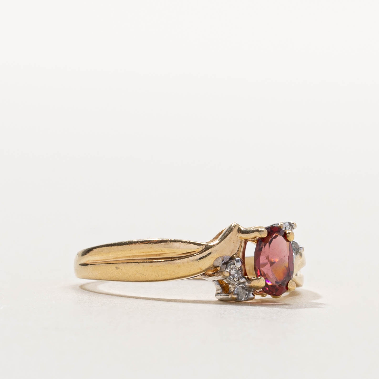 10k Garnet & Diamond Accented Crossover Ring | 0.50ct, 0.04ctw | SZ 7.75