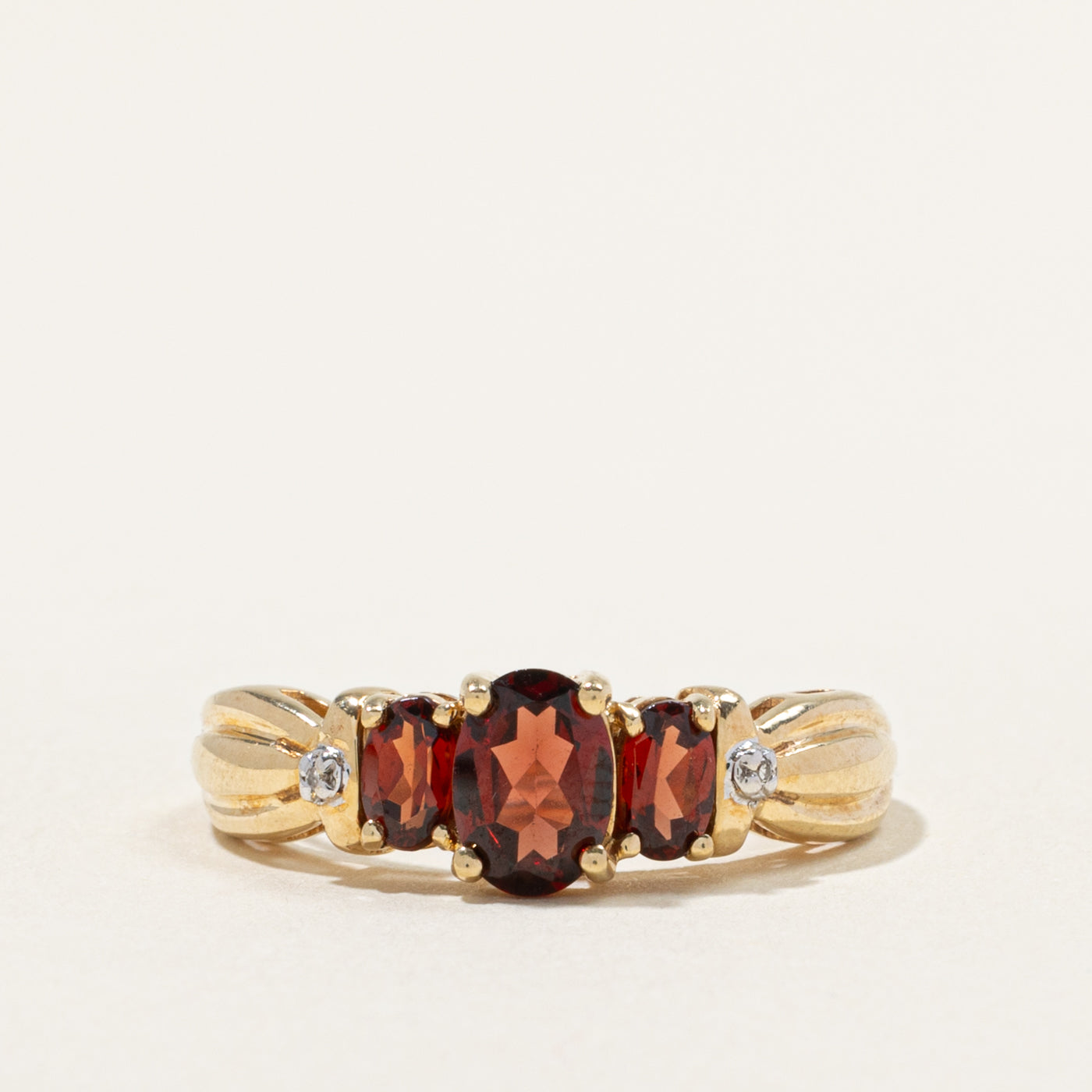 10k Three Stone Garnet & Diamond Accented Grooved Ring | 1.50ctw, 0.01ctw | SZ 8