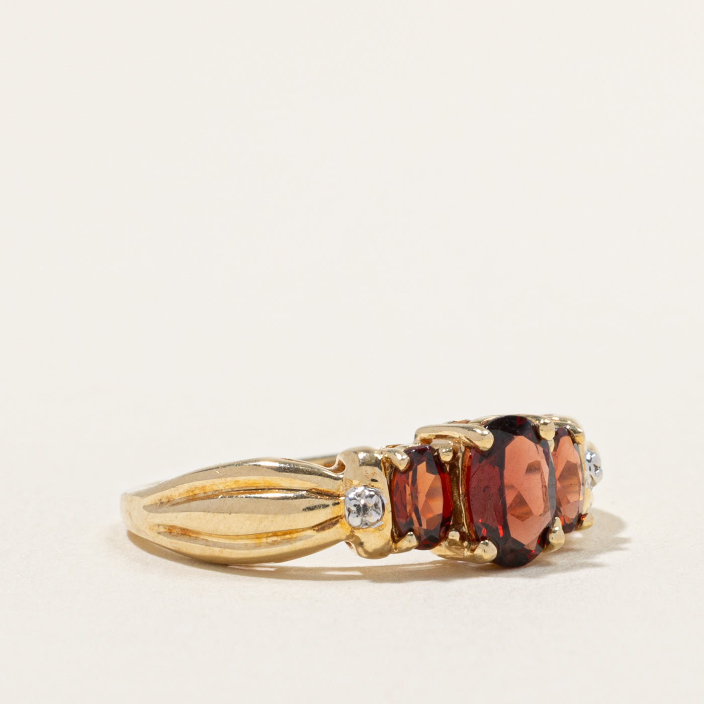 10k Three Stone Garnet & Diamond Accented Grooved Ring | 1.50ctw, 0.01ctw | SZ 8