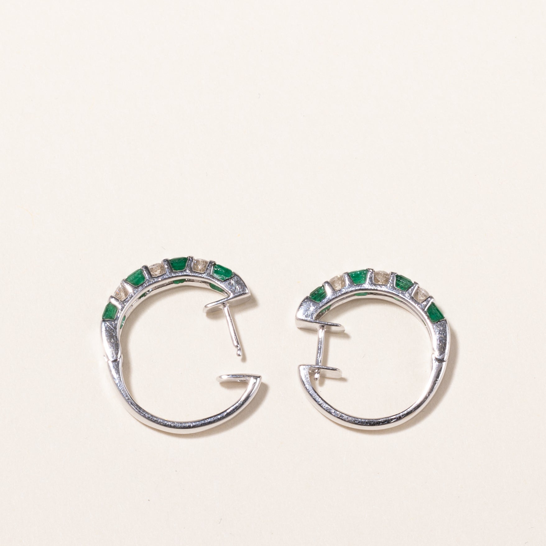 14k White Gold Emerald and Diamond Huggie Earrings | 1.07ctw, 0.43ctw | 2x2cm