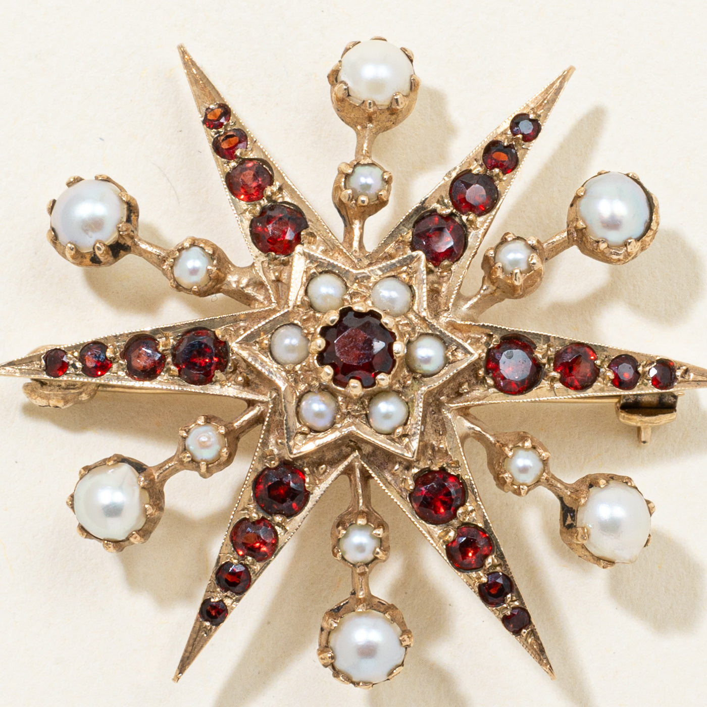 1970 London Garnet & Pearl Sunburst Brooch | 1.20ctw