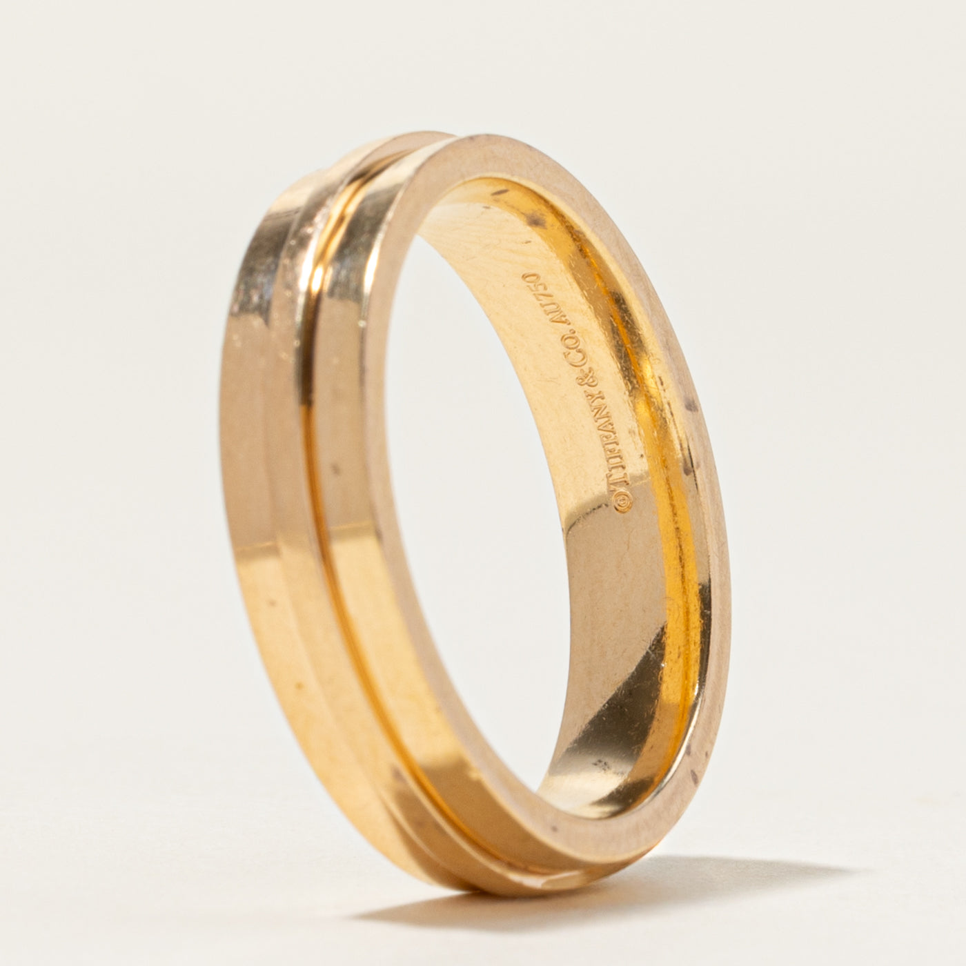 Bague large Tiffany T de Tiffany & Co en or jaune | 5,5 mm | Taille 10,5