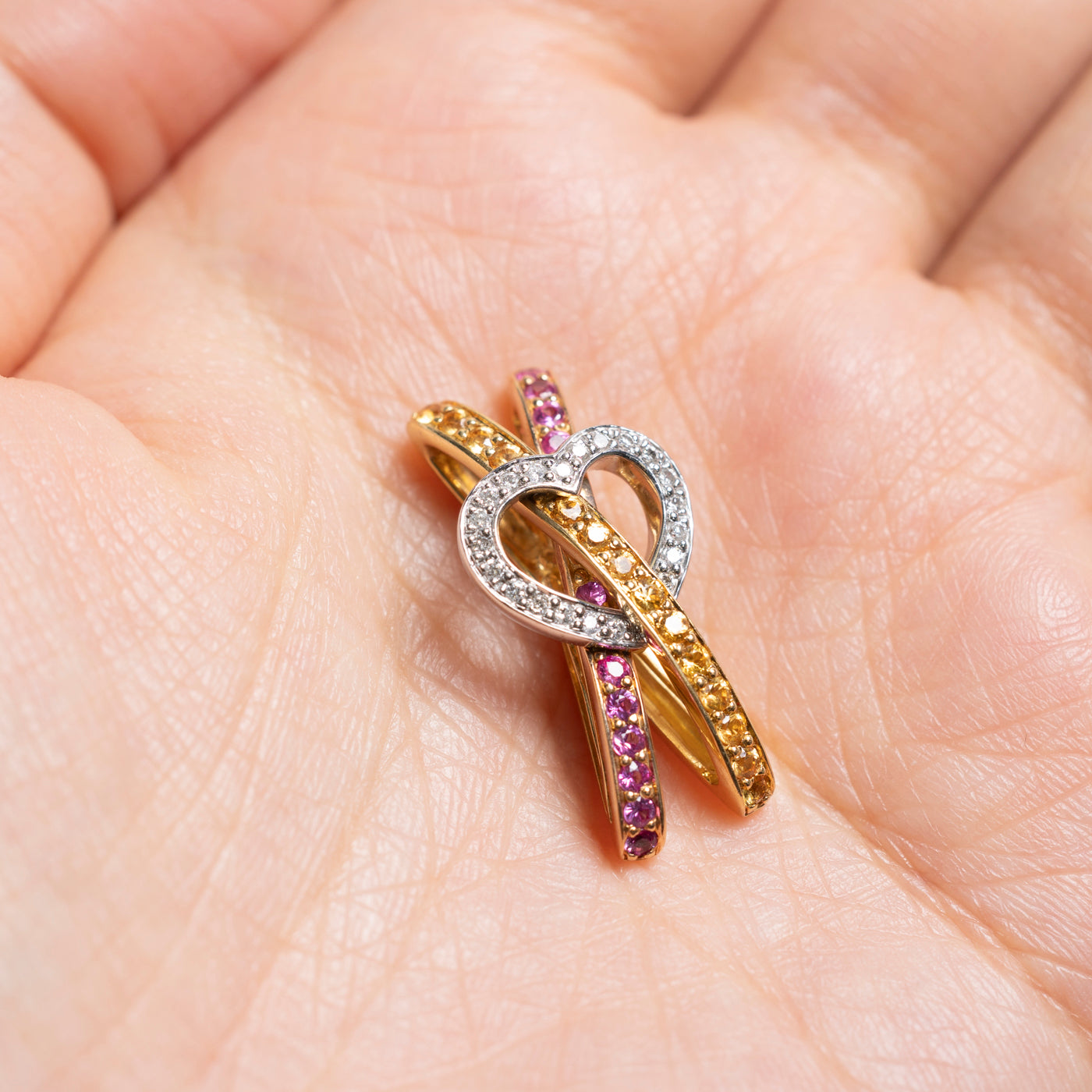 18k Yellow & Pink Sapphire & Diamond Heart Cross Over Pendant | 0.73ctw, 0.17ctw