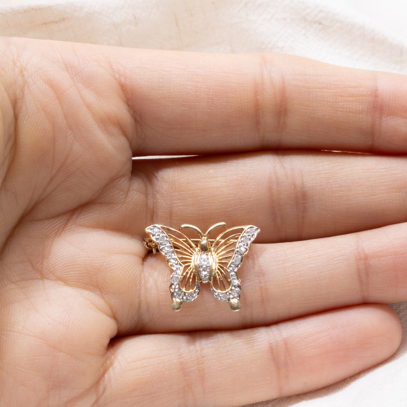 Pendentif papillon en or 10 carats et diamants