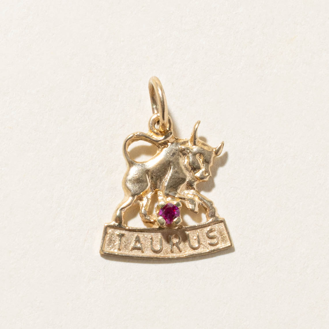 10k Synthetic Ruby Taurus Zodiac Charm