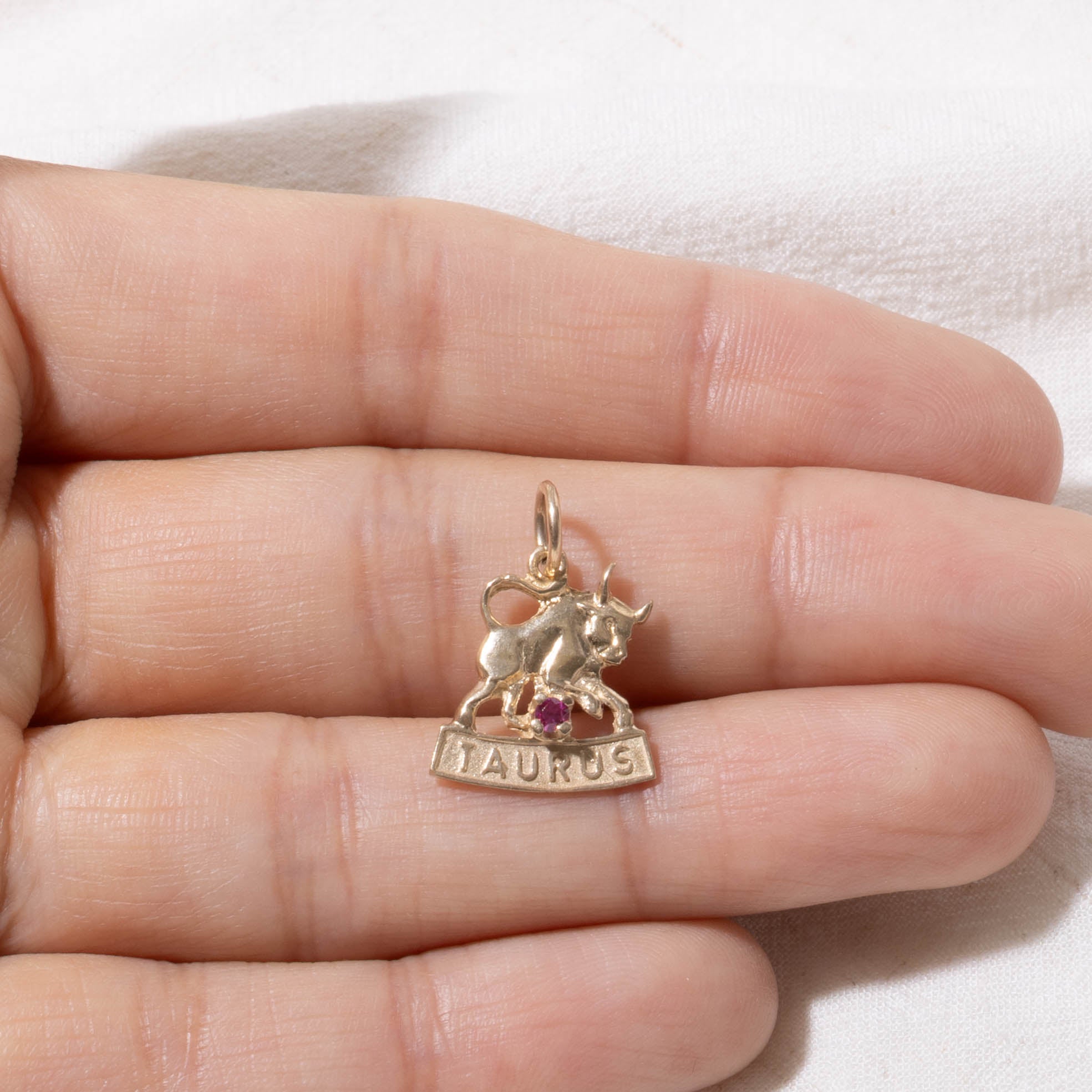 10k Synthetic Ruby Taurus Zodiac Charm