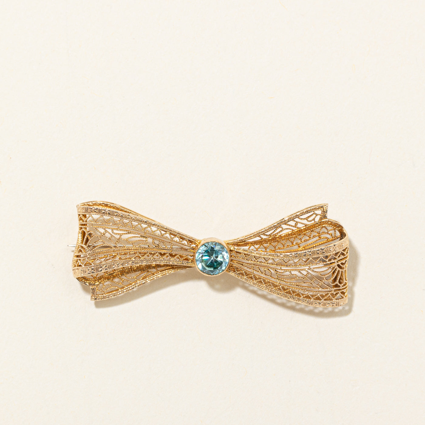Bezel Set Blue Zircon Filigree Bow Brooch | 1.10ct