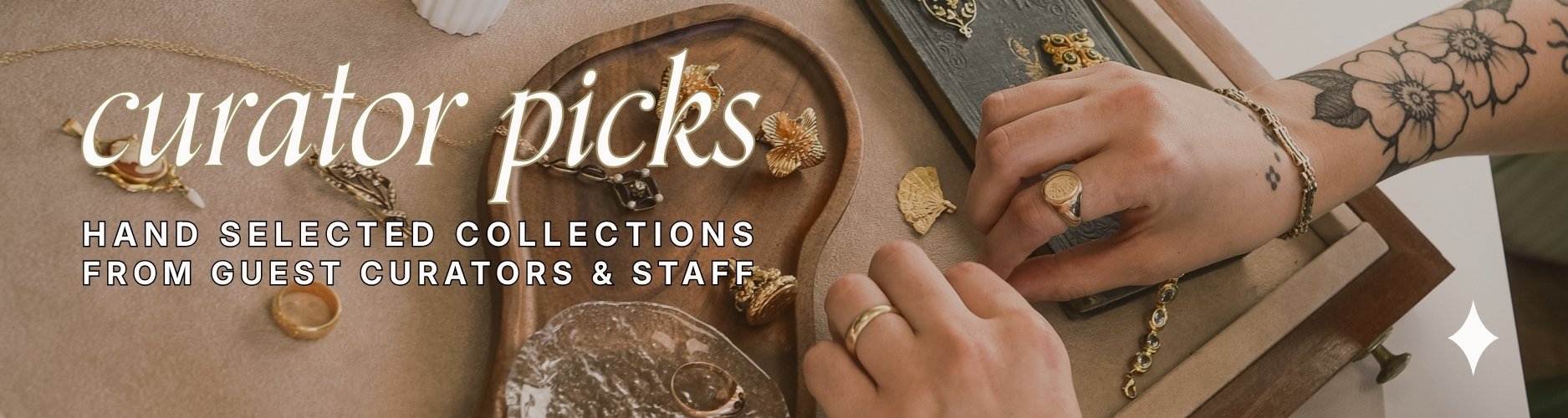 image of woman arranging gold and gemstone vintage jewellery on display tray, text over reads 'curator picks; hand selected collections from guest curators and staff'
