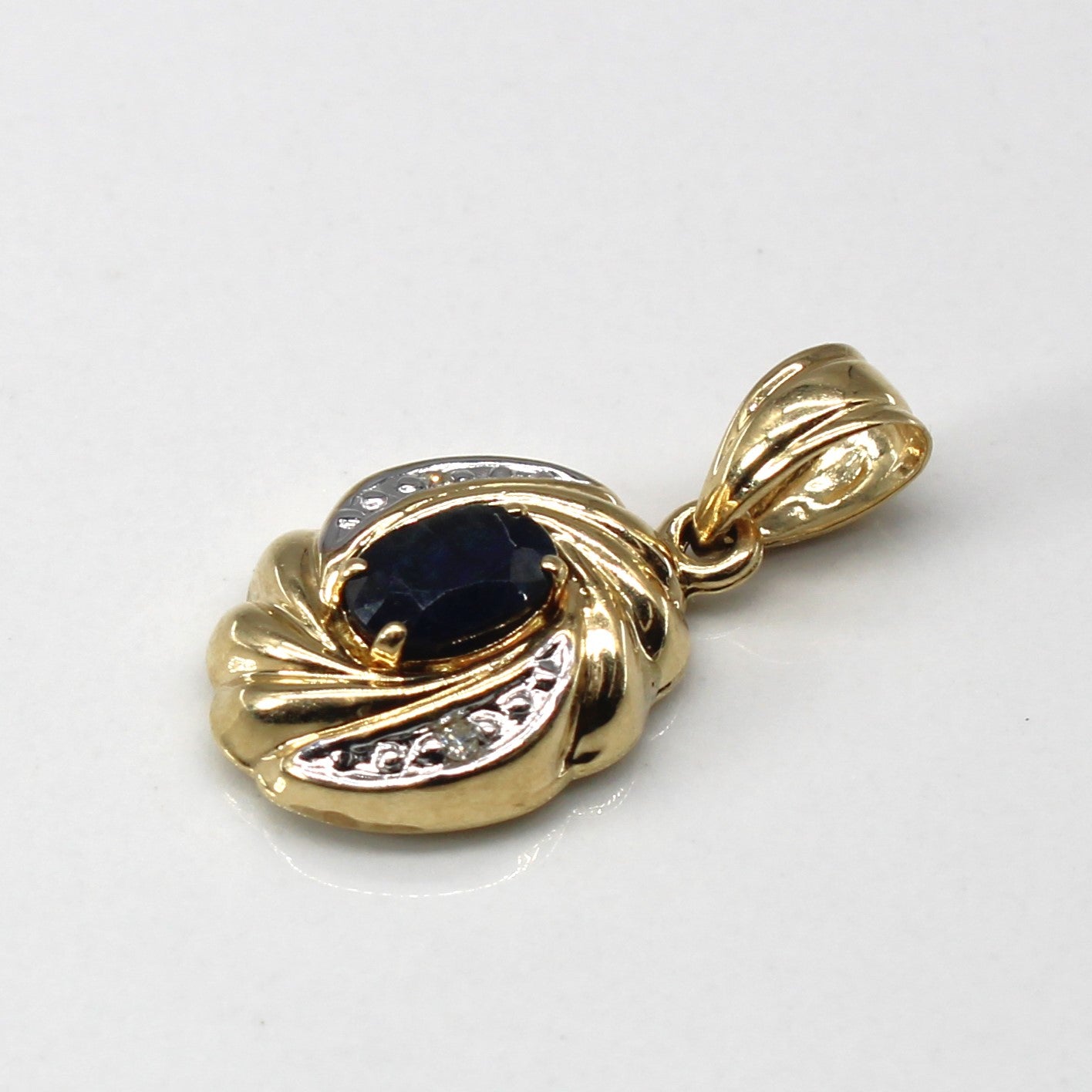 Sapphire & Diamond Swirl Gold Pendant | 0.50ct | 0.01ctw |