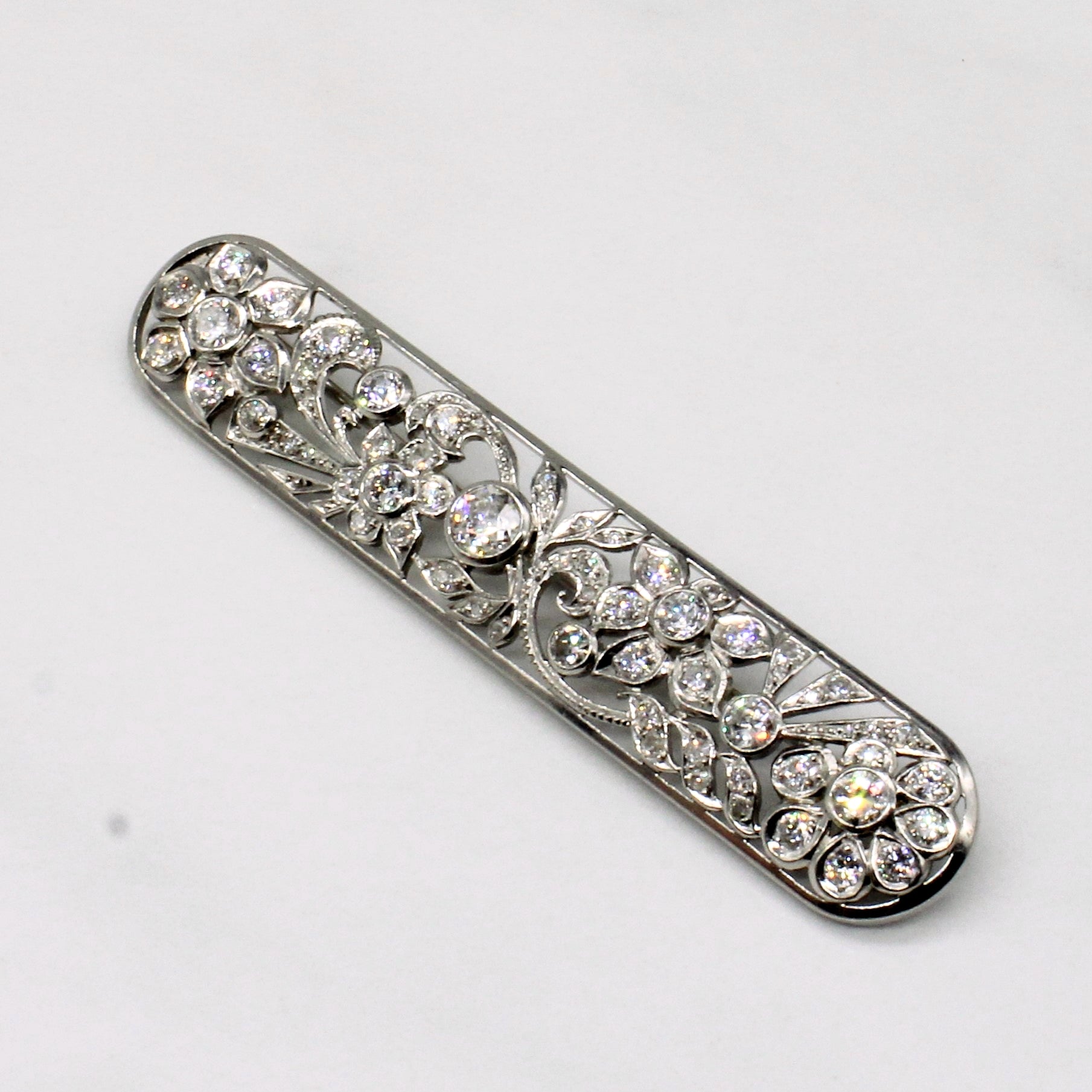 Vintage Pierced Platinum Flower and Leaf Old European Diamond Brooch | 0.39ctw, 1.88ctw, 0.44ctw |