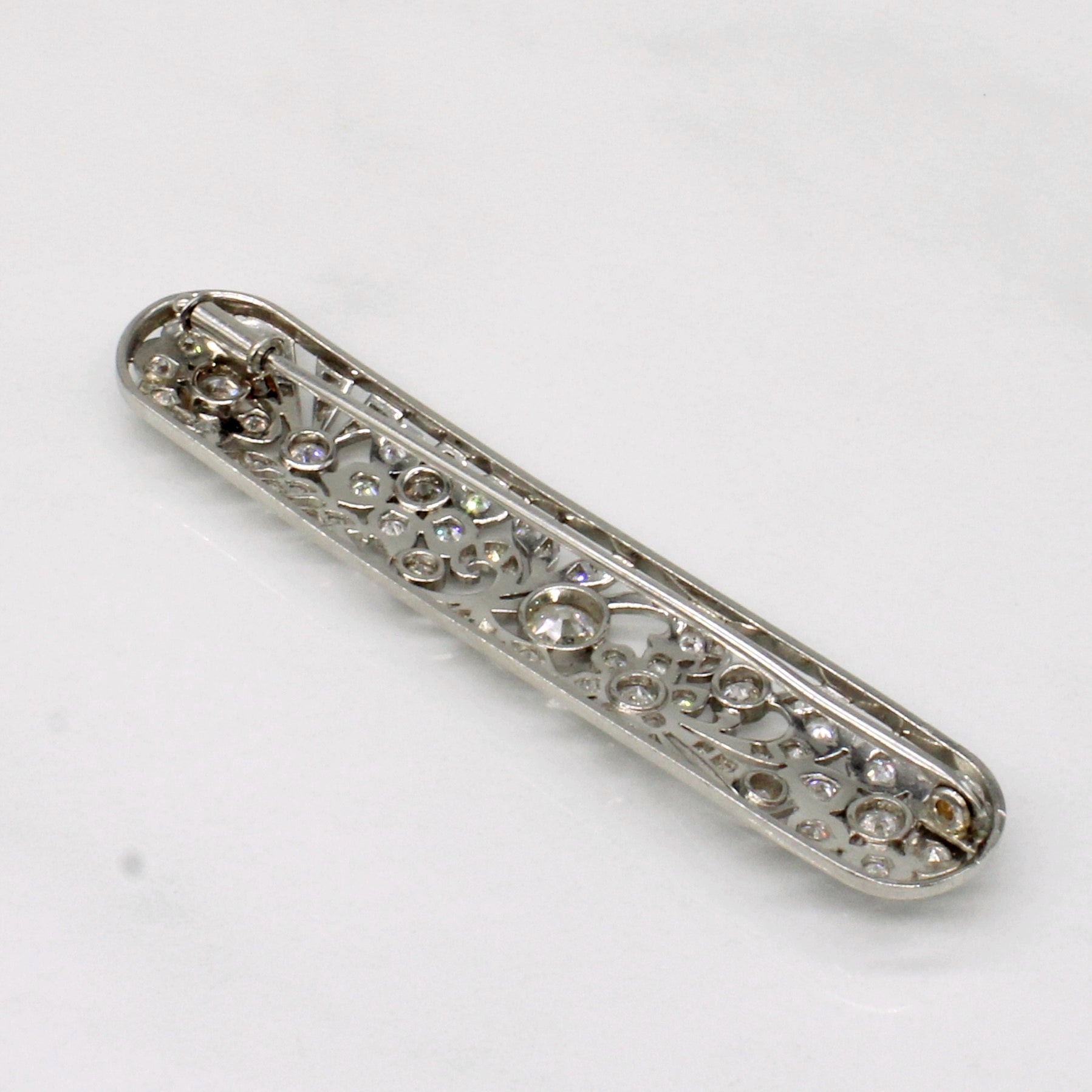 Vintage Pierced Platinum Flower and Leaf Old European Diamond Brooch | 0.39ctw, 1.88ctw, 0.44ctw |