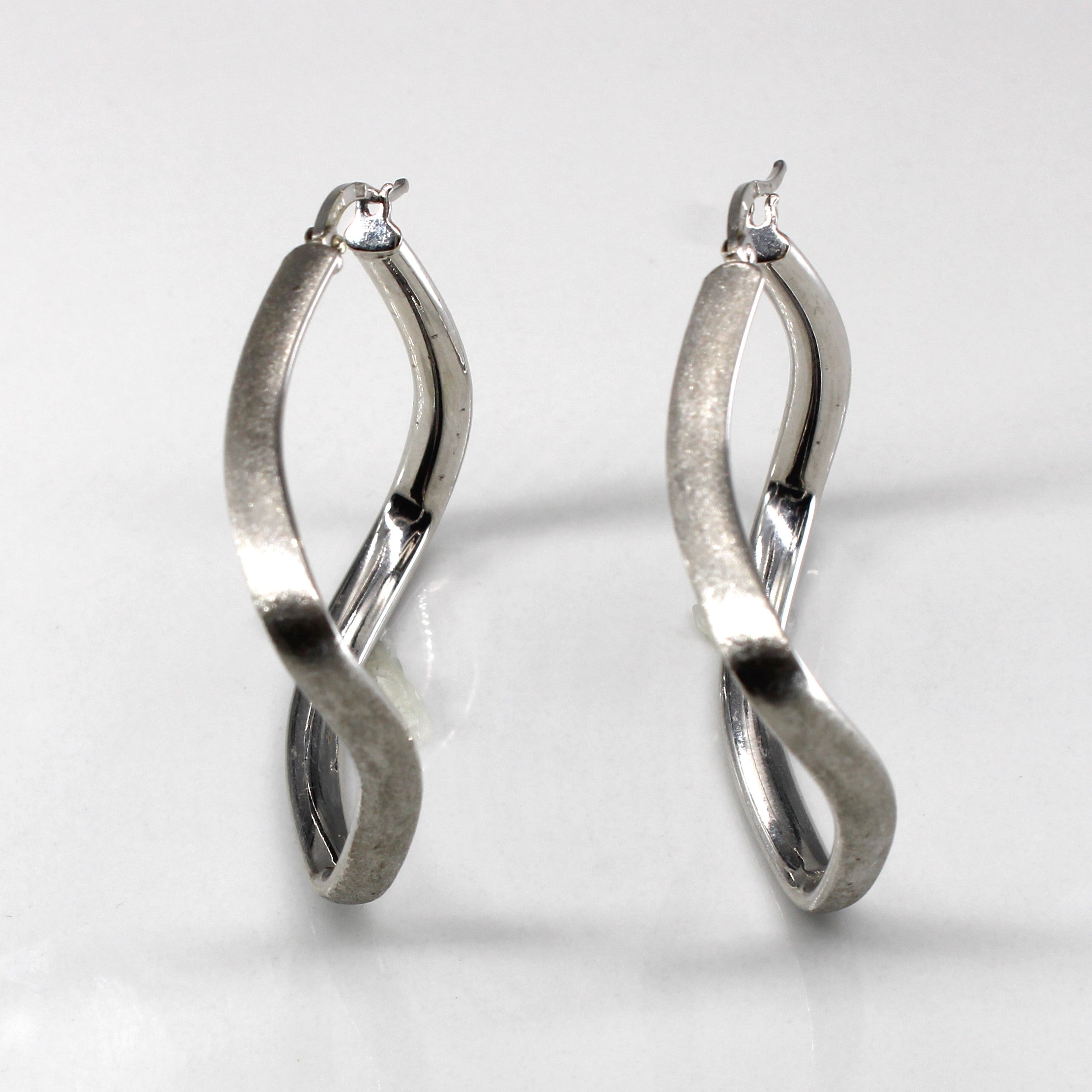 White Gold Wavy Hoop Earrings