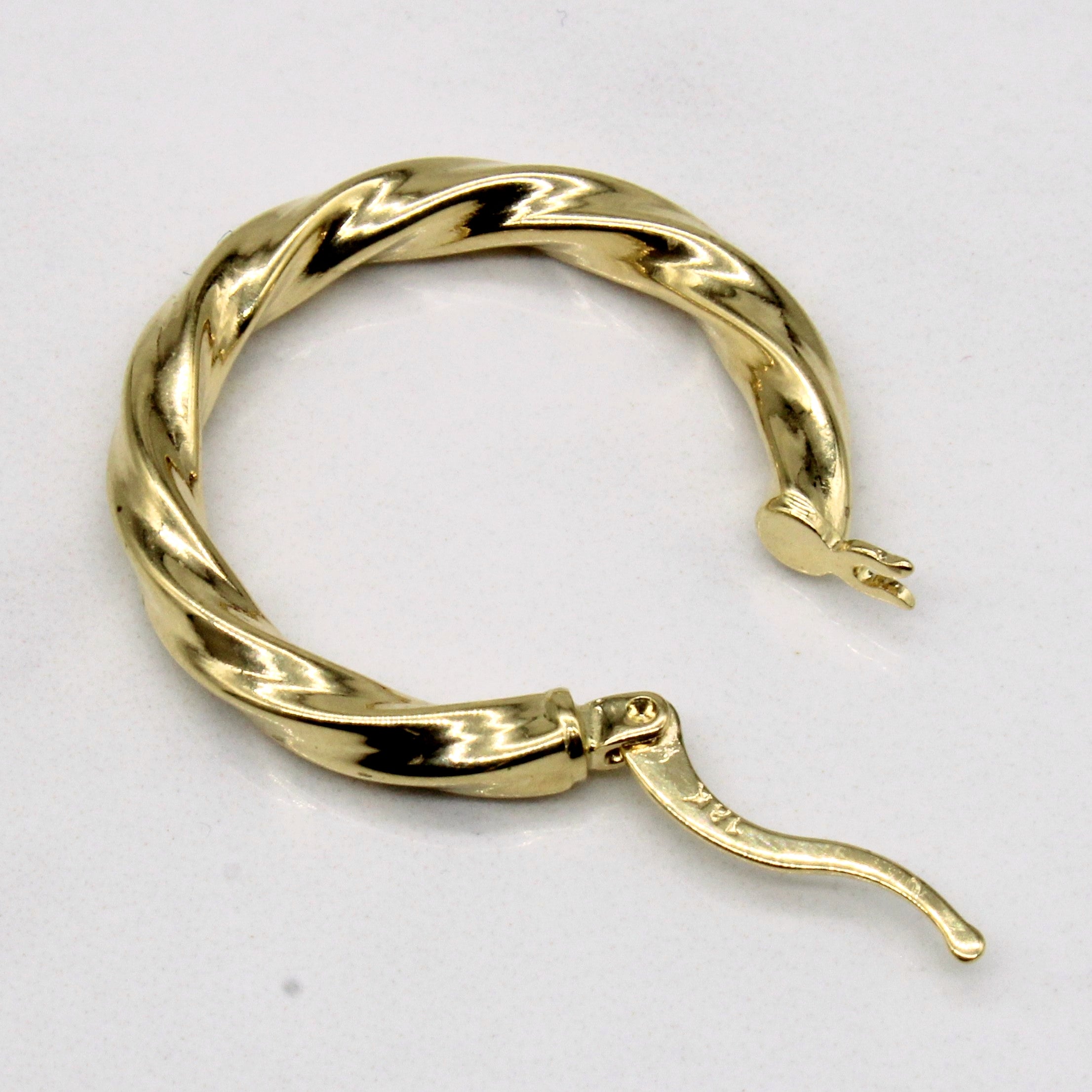 Boucles d'oreilles créoles torsadées en or jaune 18 carats 