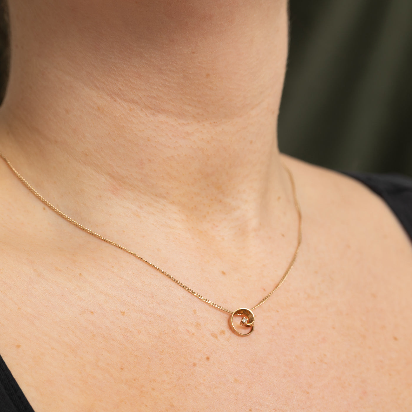 10K Diamond Swirl Circle Pendant