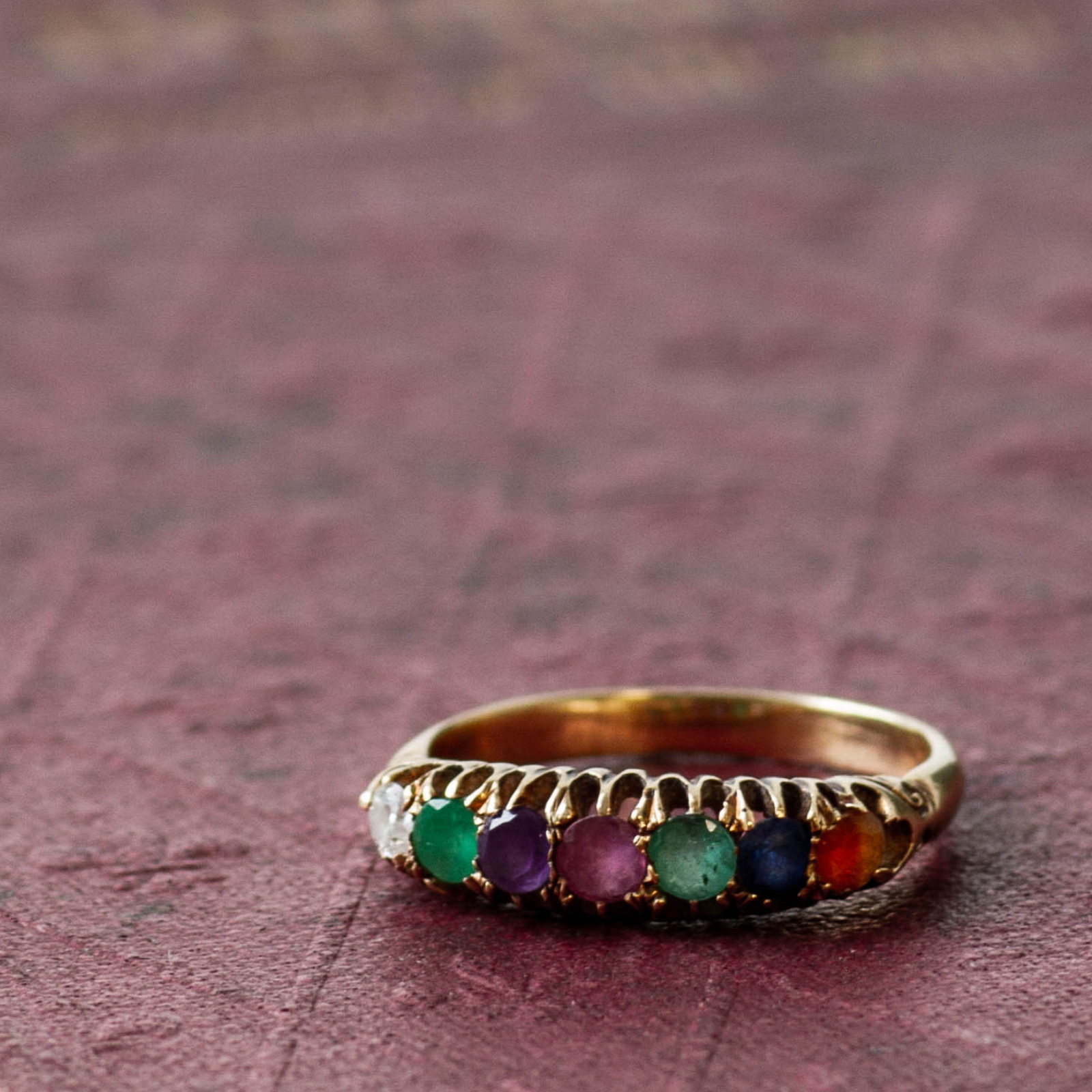 Acrostic multi-gemstone, vintage ring "DEAREST" featuring diamond, emerald, amethyst, ruby, sapphire, and topaz in a rainbow setting