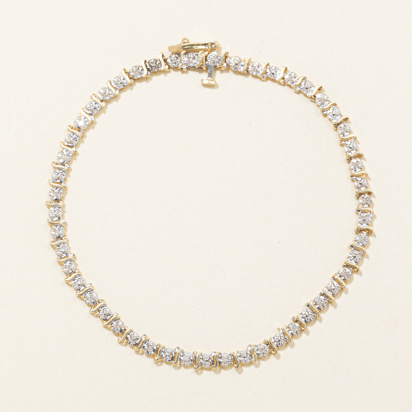 10K Yellow Gold Illusion Set Diamond Swirl Tennis Bracelet | 0.10ctw | 7"