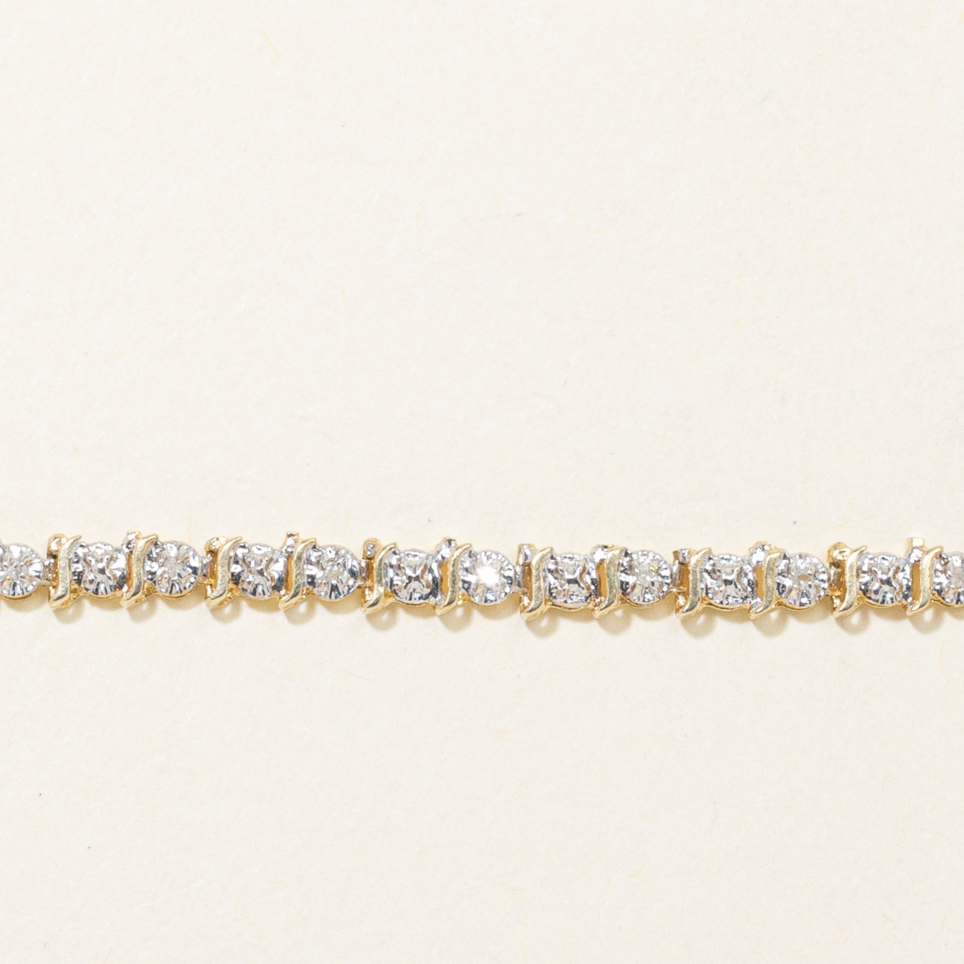 10K Yellow Gold Illusion Set Diamond Swirl Tennis Bracelet | 0.10ctw | 7"