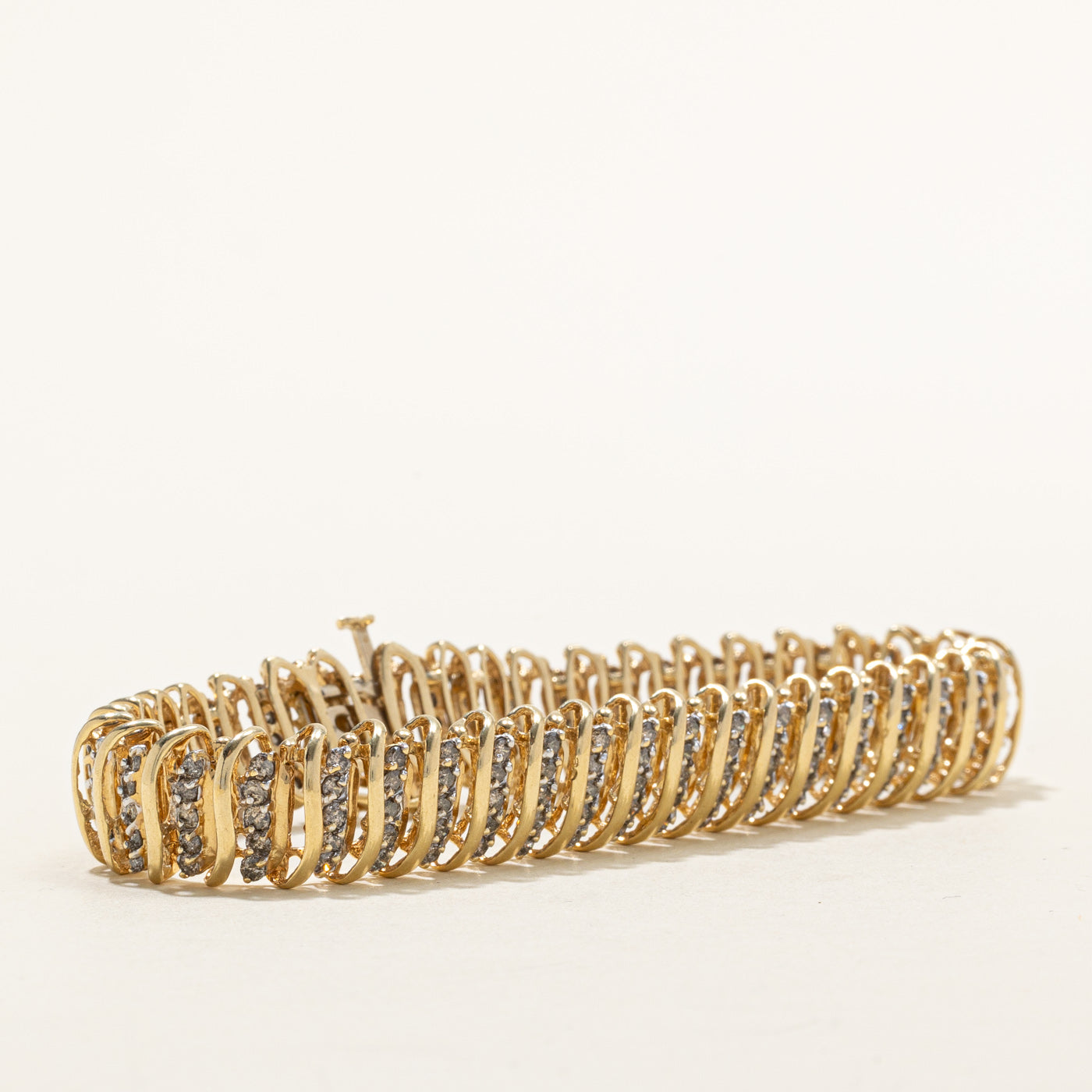 Bracelet tennis en or 14 carats serti de diamants tourbillonnants | 1,00 ct au total | 18,4 cm