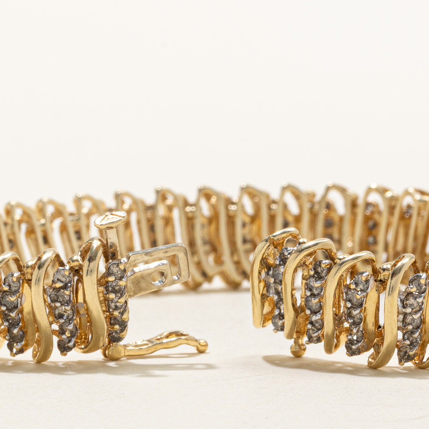Bracelet tennis en or 14 carats serti de diamants tourbillonnants | 1,00 ct au total | 18,4 cm