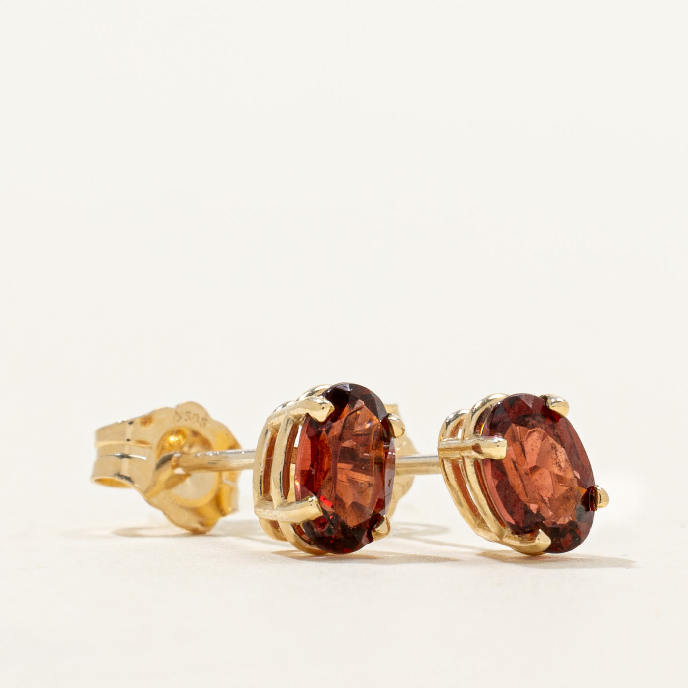 '100 Ways' Oval Cut Garnet Solitaire Stud Earrings | 1.05ctw