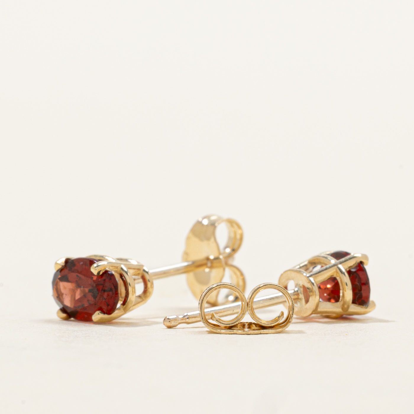 '100 Ways' Oval Cut Garnet Solitaire Stud Earrings | 1.05ctw