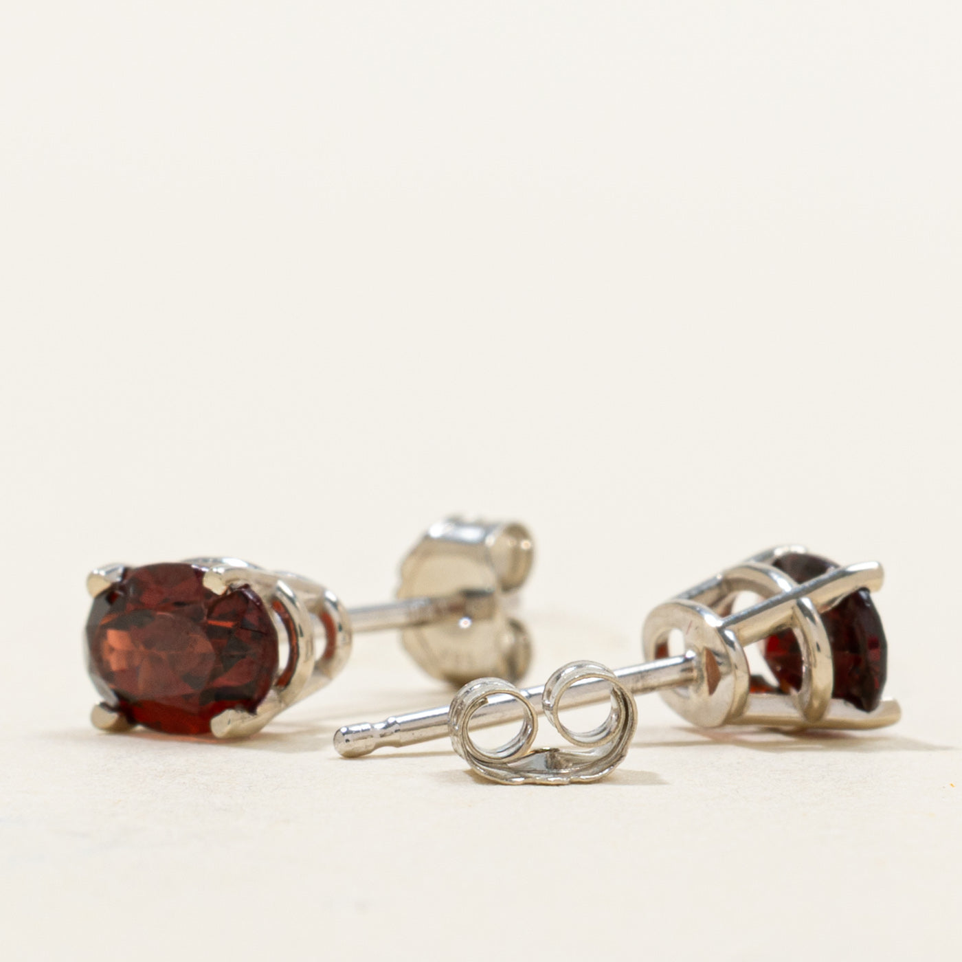 '100 Ways' Oval Cut Garnet Solitaire Stud Earrings | 1.05ctw