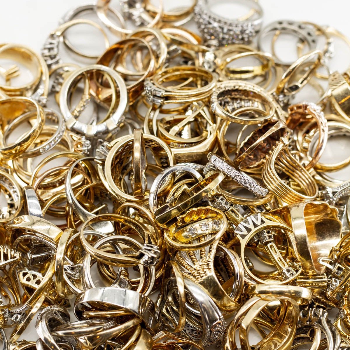 image of heaps of fine gold and diamond pre-owned jewelry for sorting