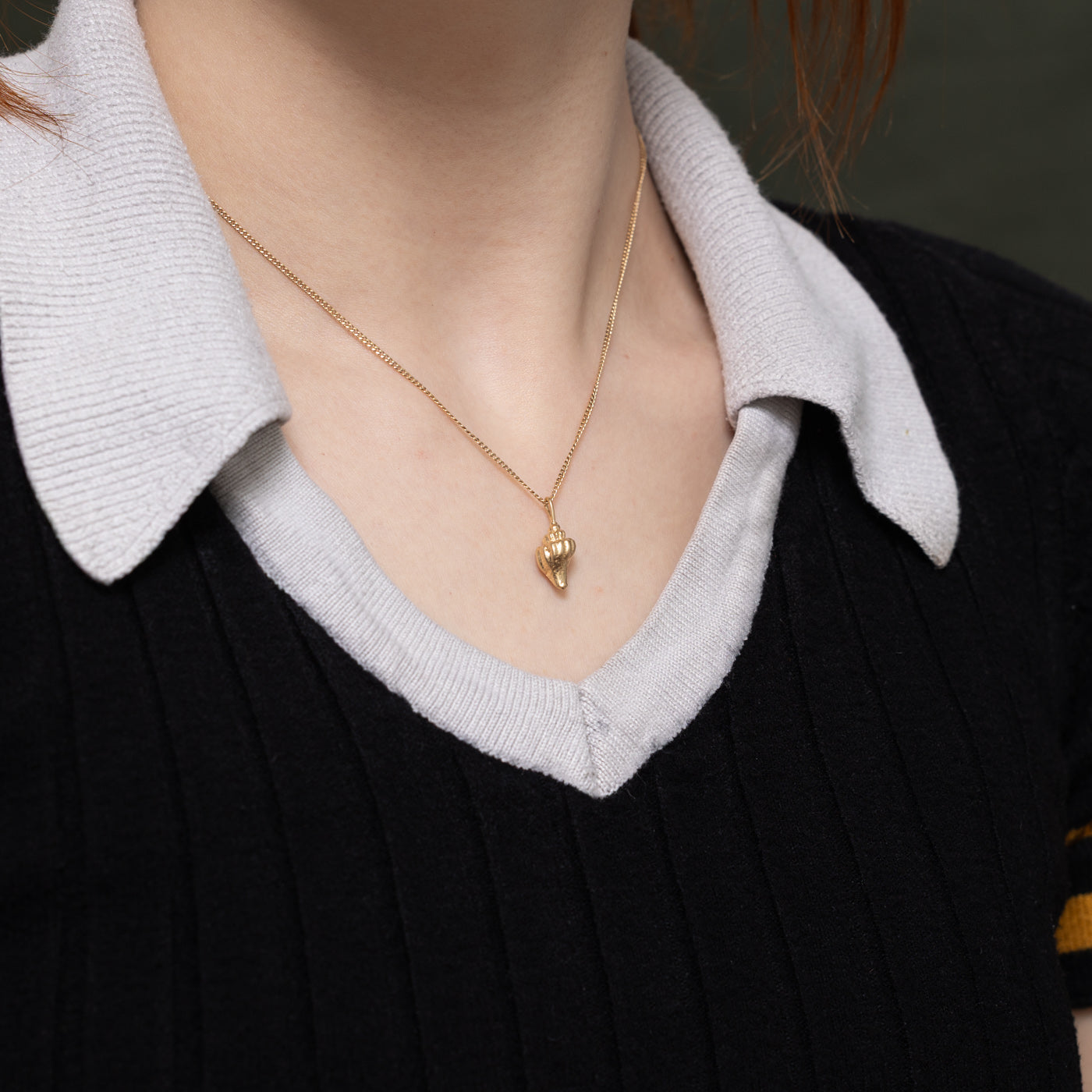 Breloque coquillage en or jaune 14 carats