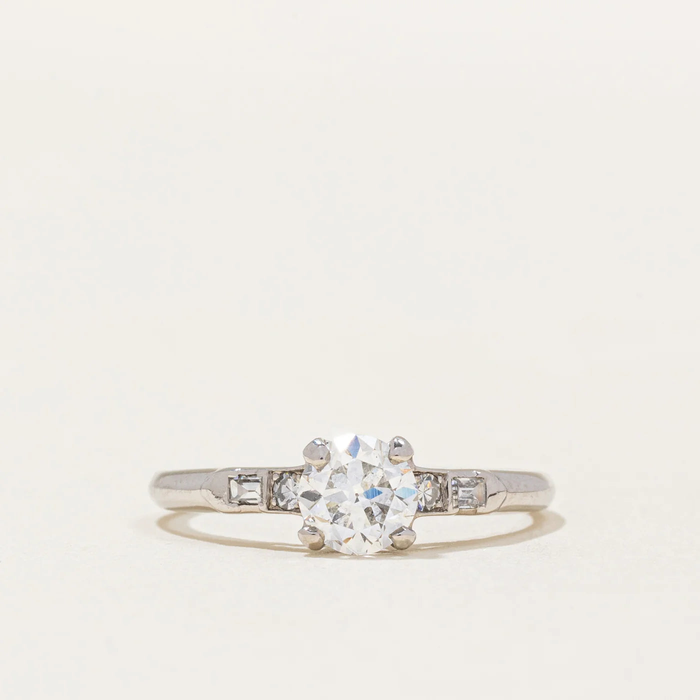 vintage old european cut engagement ring with round brilliant and baguette accents