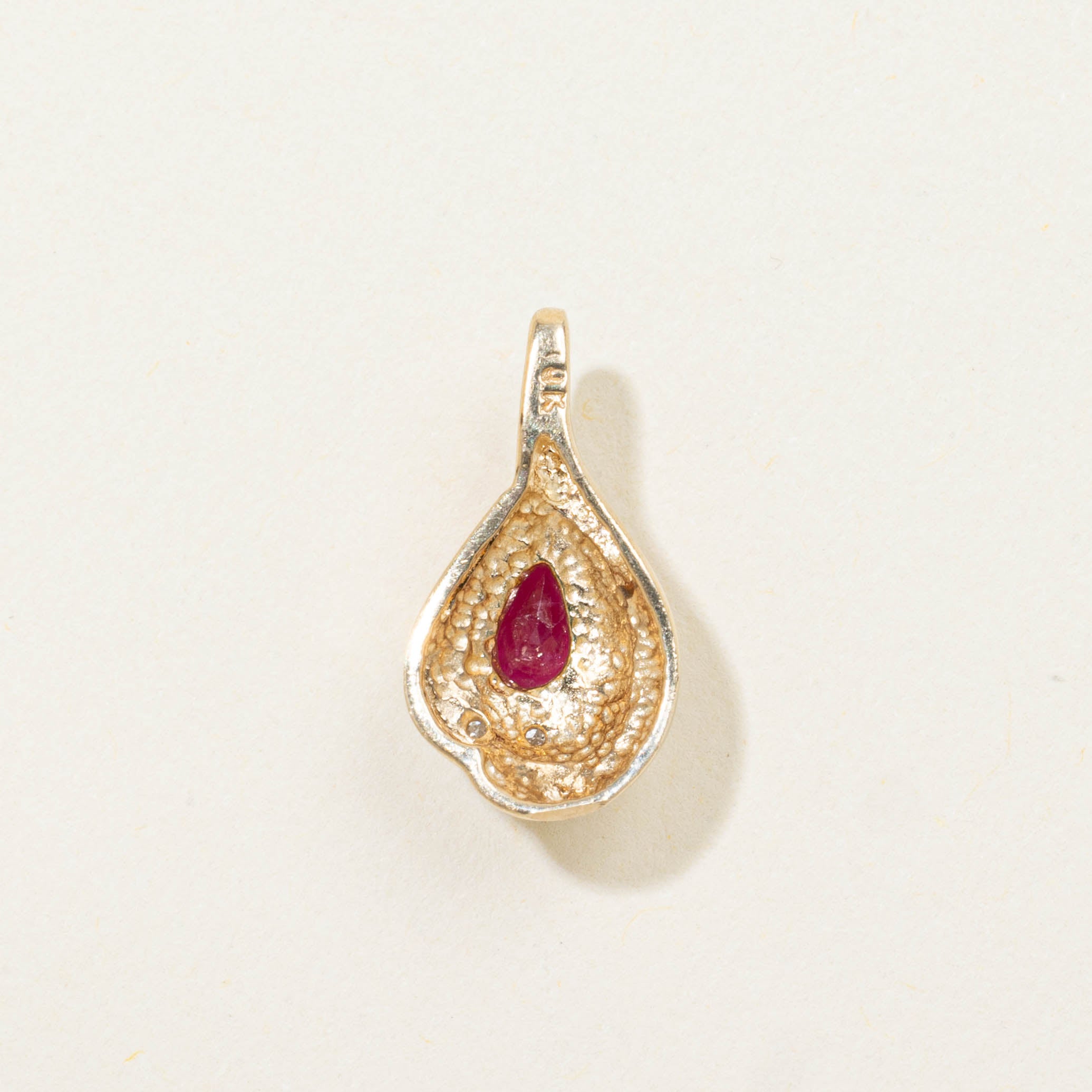 10k Pear Cut Ruby & Diamond Accented Pendant