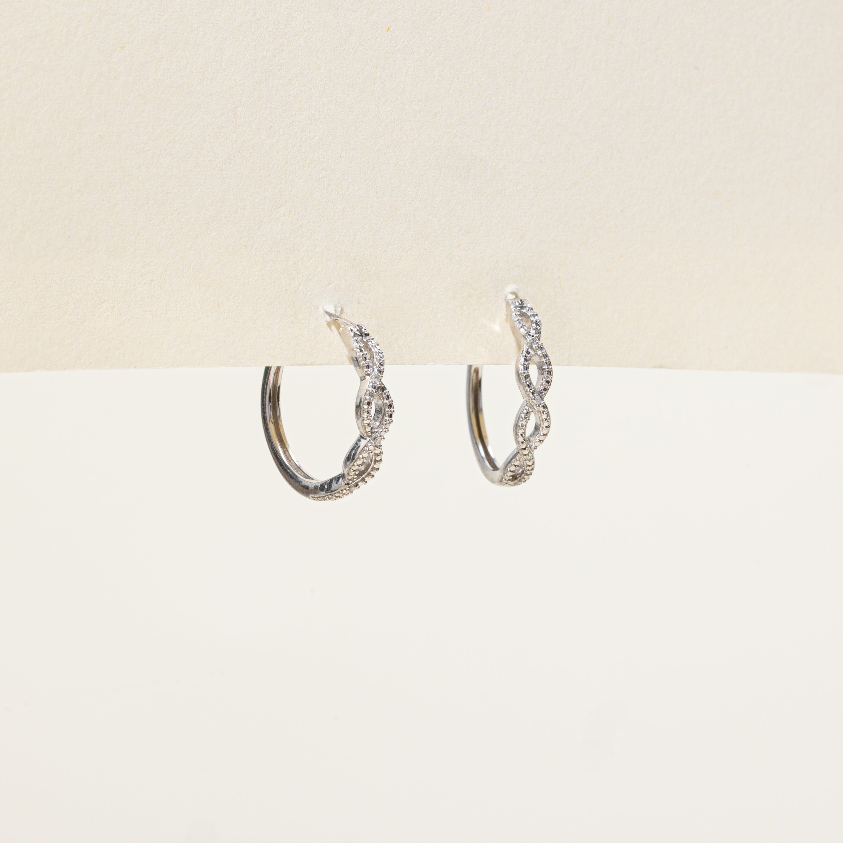 Sterling Silver Diamond Cross Over Hoop Earrings | 0.01ctw