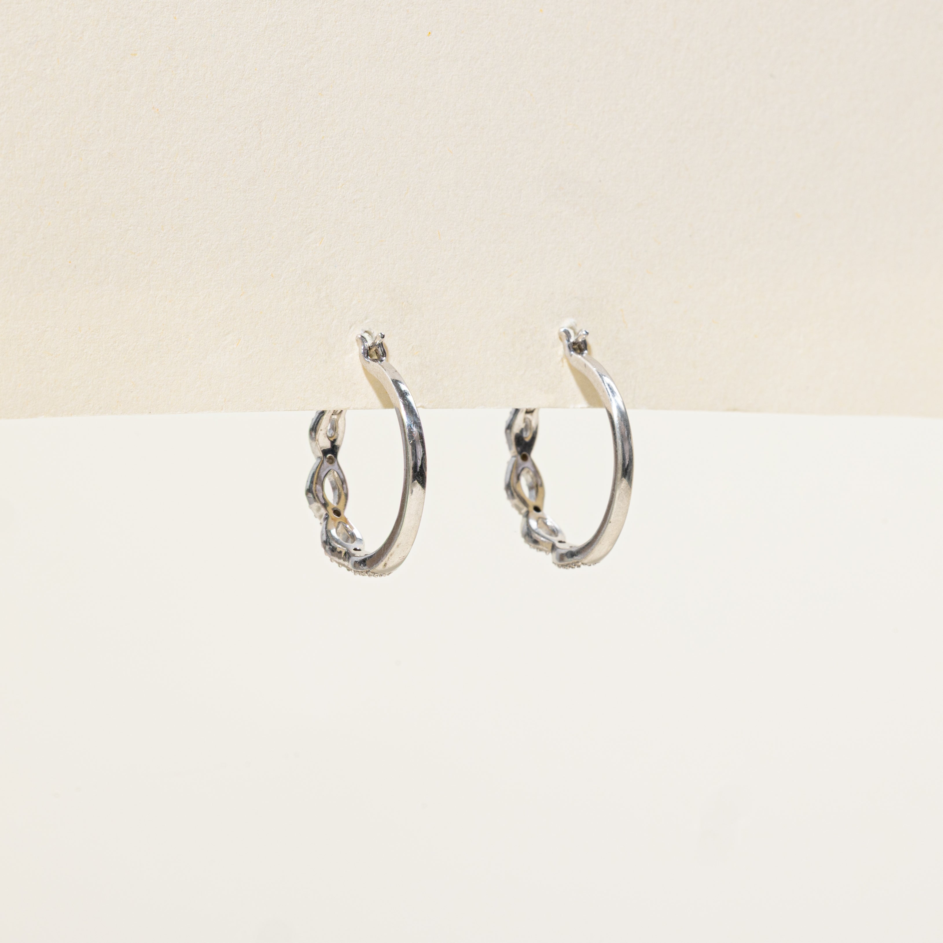 Sterling Silver Diamond Cross Over Hoop Earrings | 0.01ctw