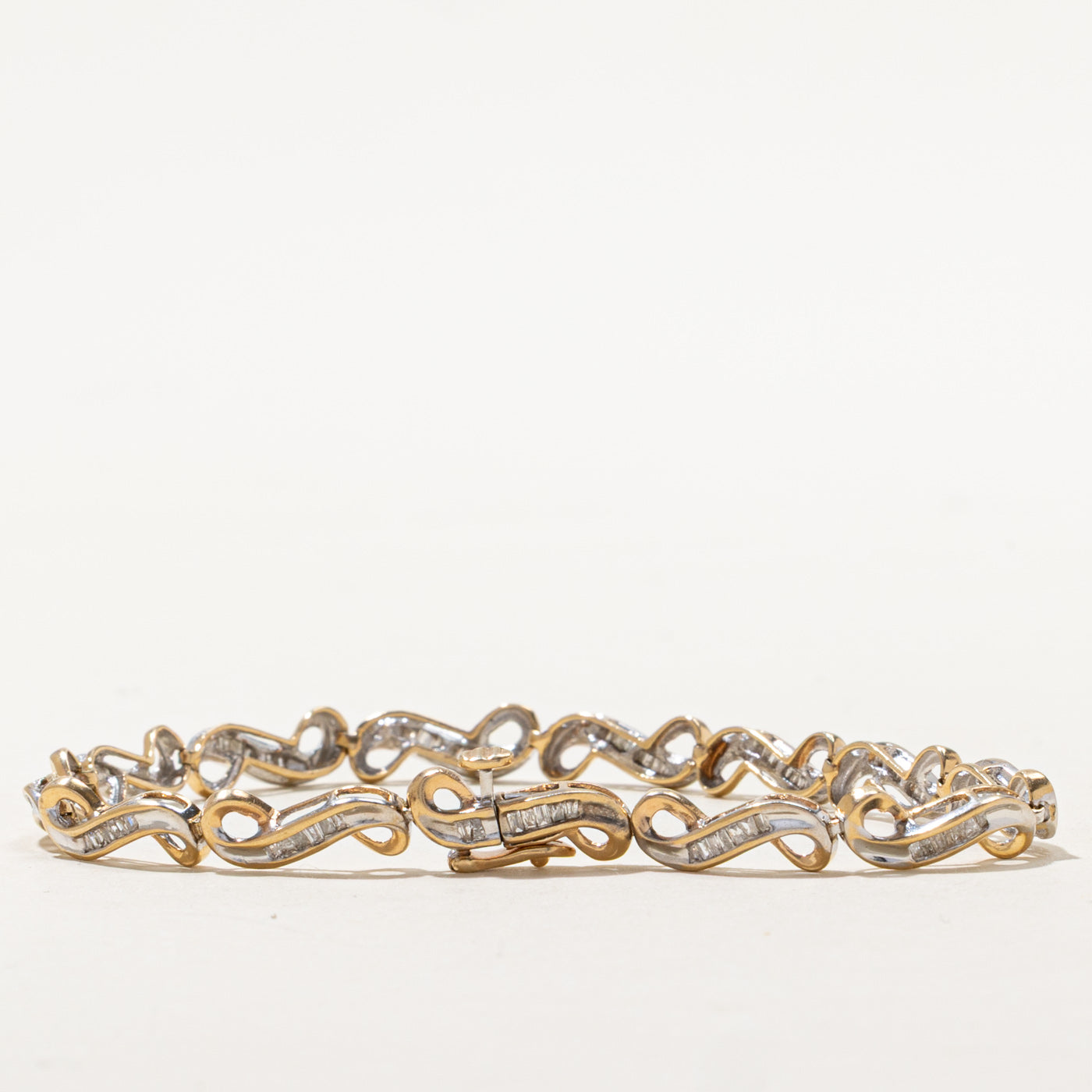 Bracelet tennis bicolore en or et diamants tourbillonnants | 1,05 ct au total | 19 cm